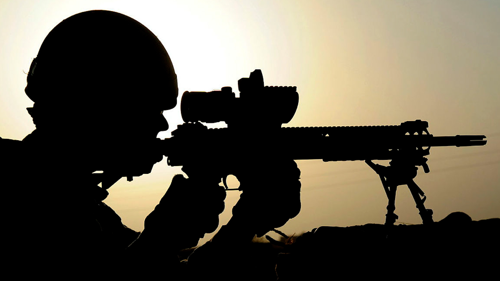 Anonymous soldier from 1st Battalion The Scots Guards looking through the scope of his sharpshooter rifle 