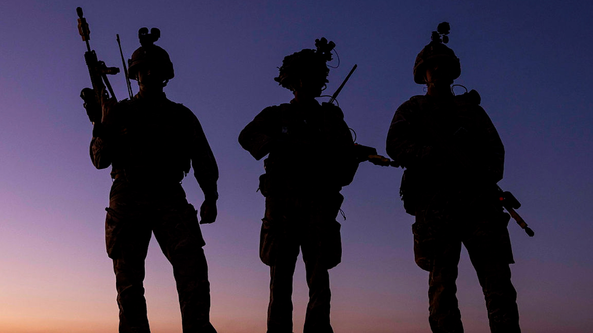 Soldiers conduct an action at night time in Jordan