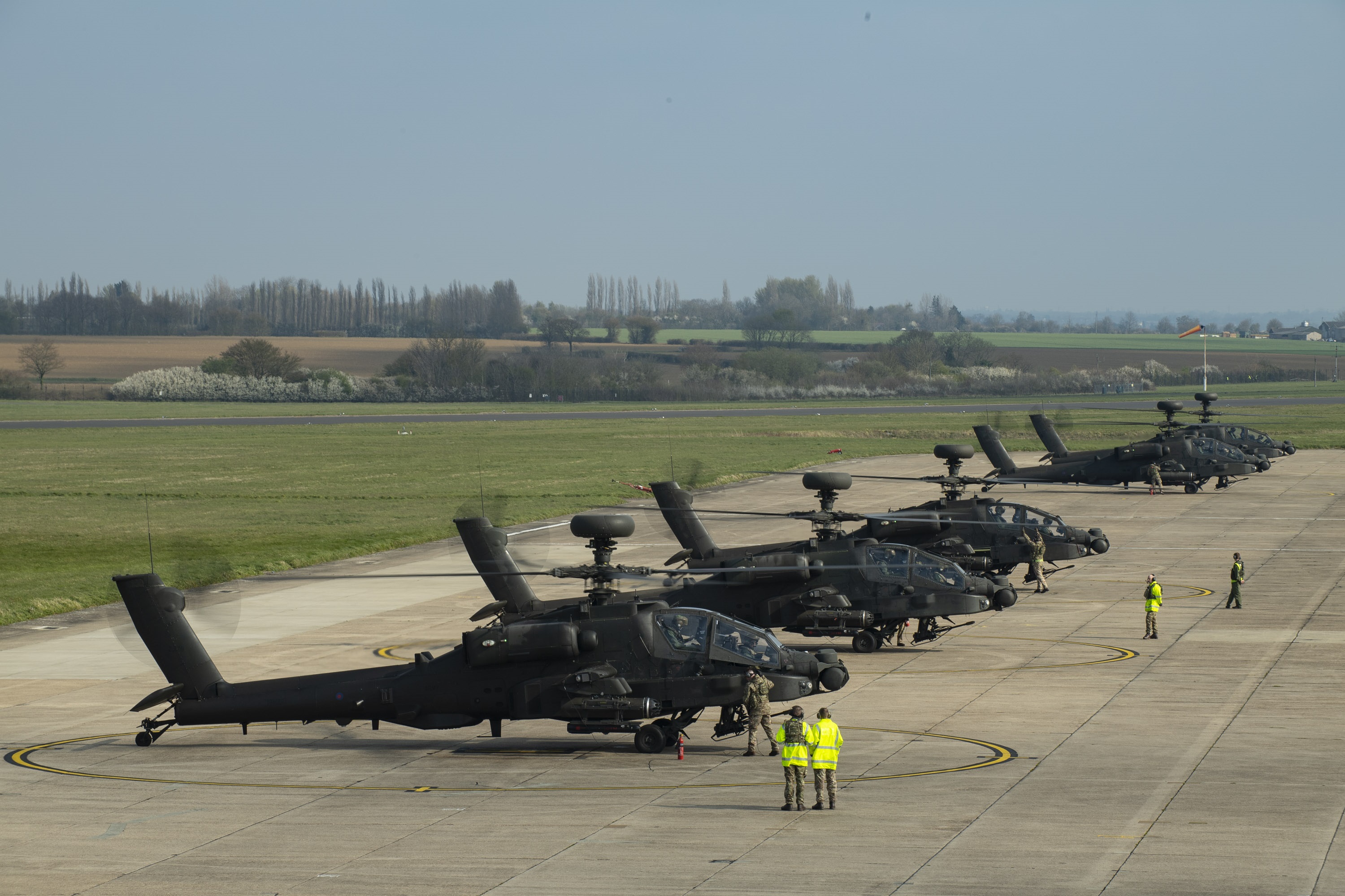 Apache helicopters on airfield apron