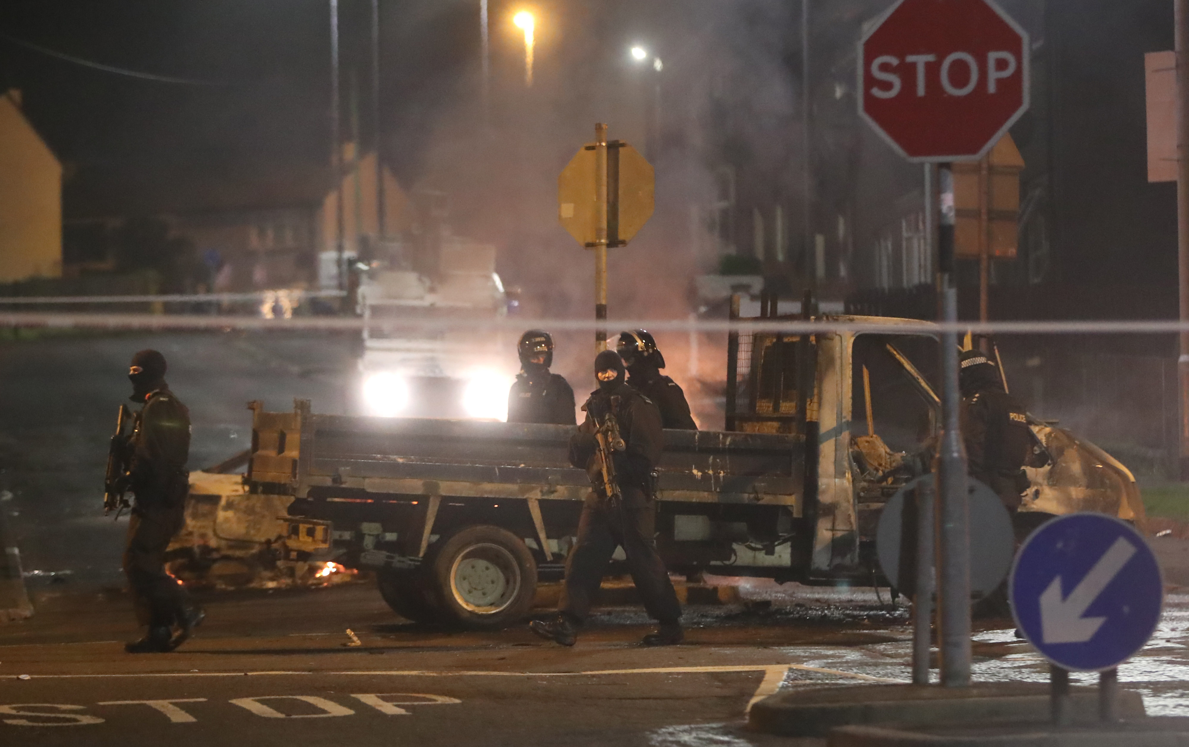 Armed police in Creggan, Londonderry, on Thursday evening (Picture: PA).
