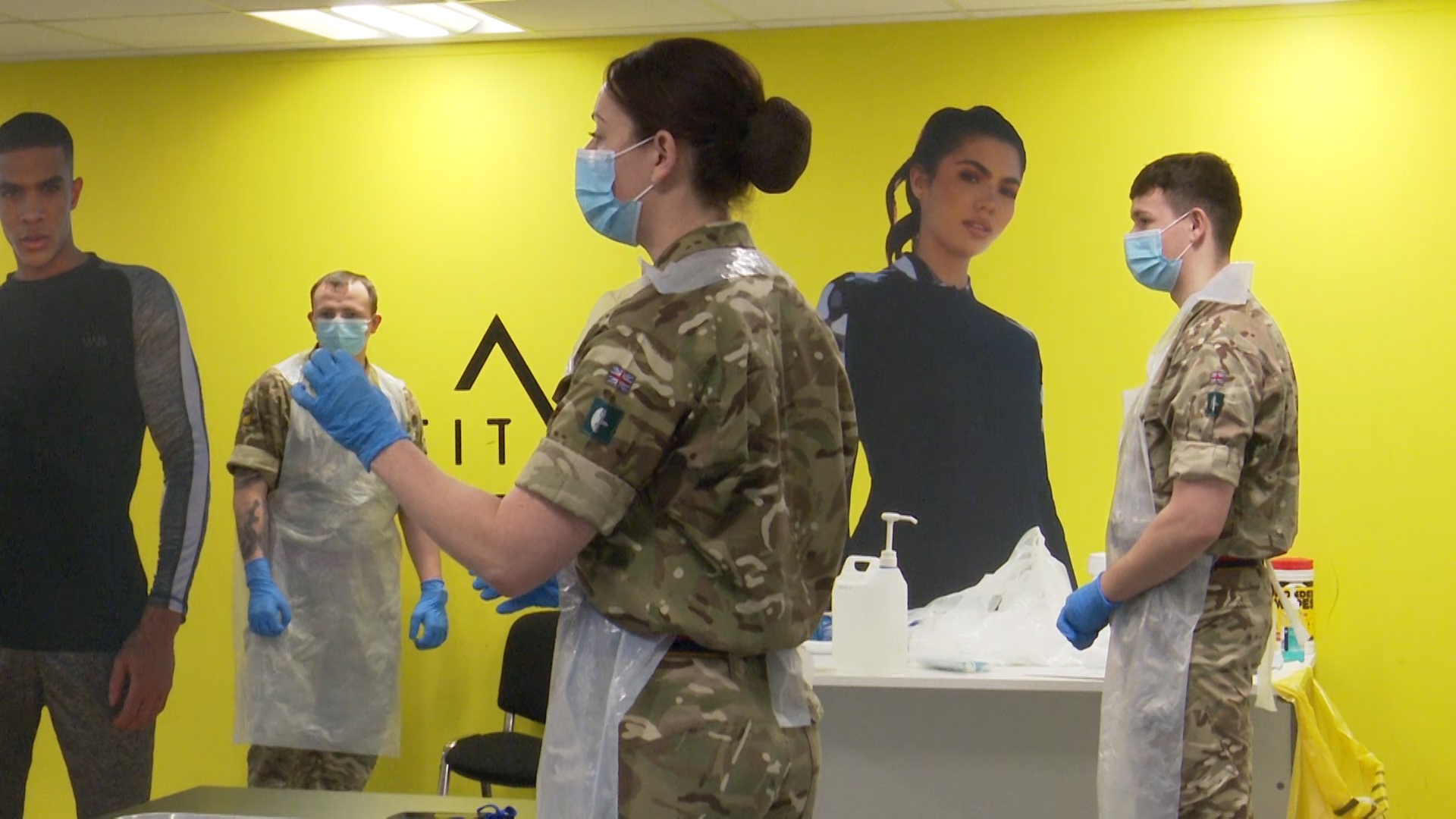 Soldiers train staff to carry out the testing at Boohoo's warehouses and offices in Burnley.