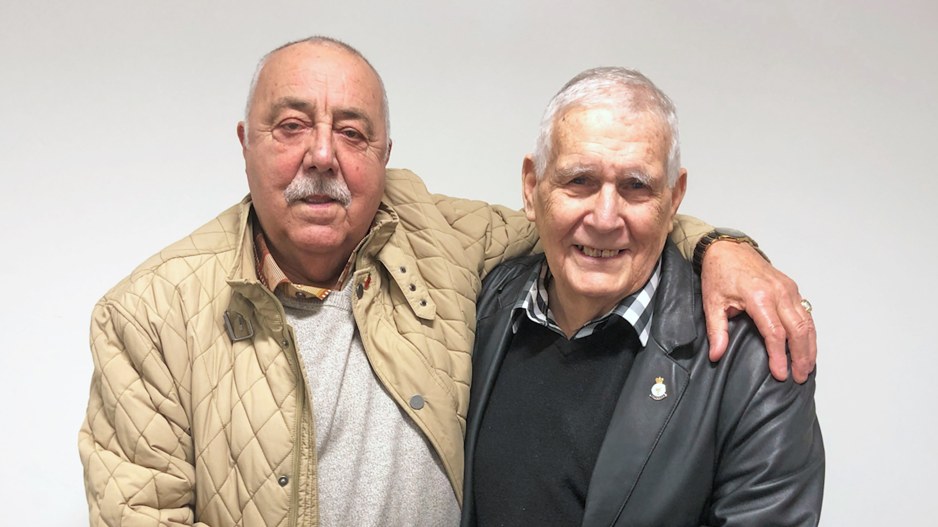 Cover image: (Left to right): Army veterans John Halloran and John Stacey reunited in Cardiff after 60 years (Picture: PA).
