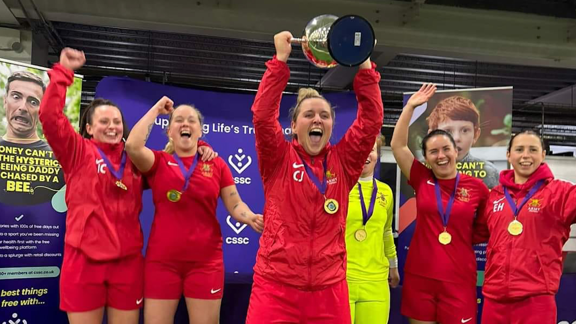 Army women's footballers lift the trophy after beating a Navy team at St George's Park (Picture: Army Football Association)