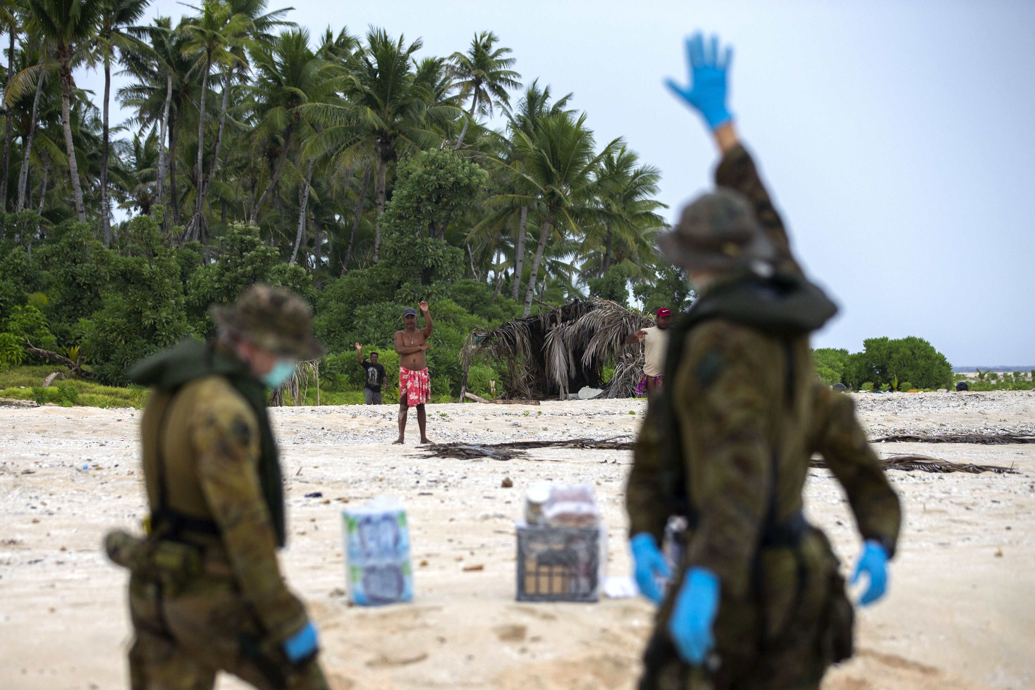 Australian personnel gave the stranded men food and water before they were picked up by a Micronesian patrol boat (Picture: @AustralianArmy/Twitter).