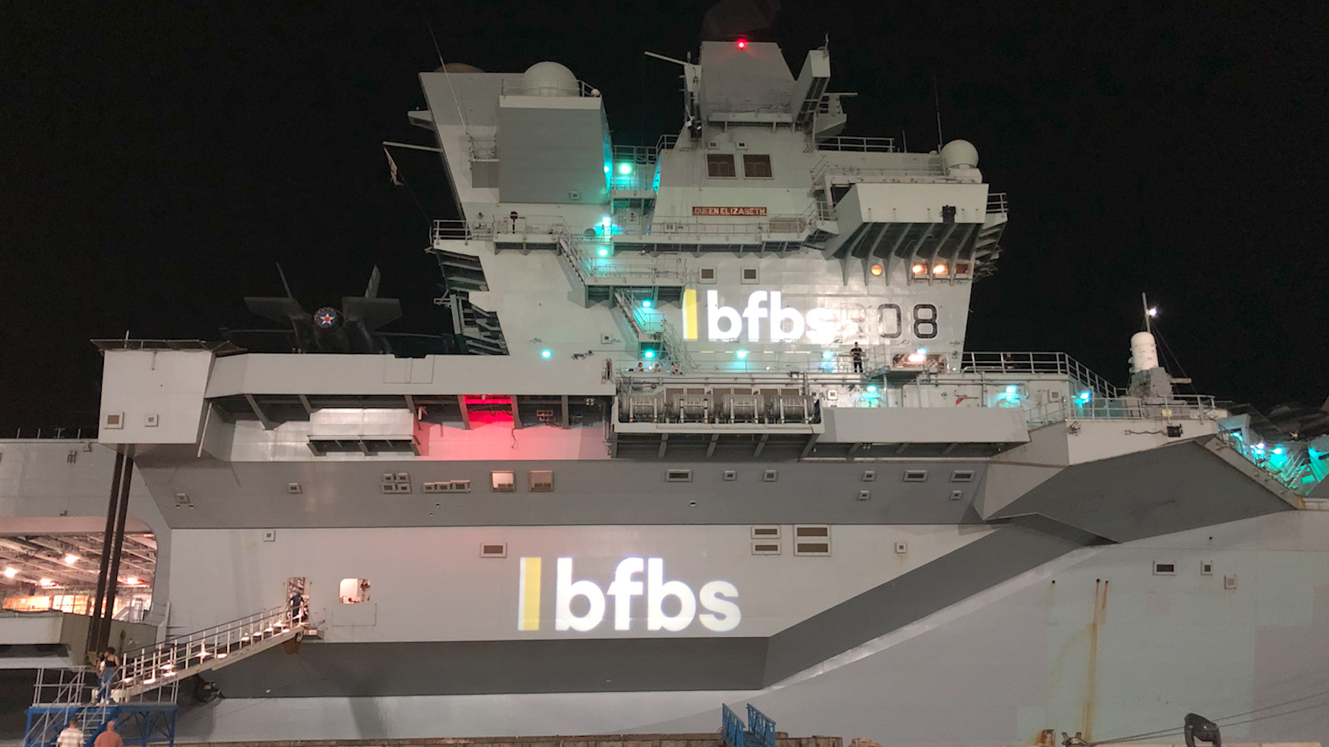 BFBS branding beamed onto HMS Queen Elizabeth as part of live show.