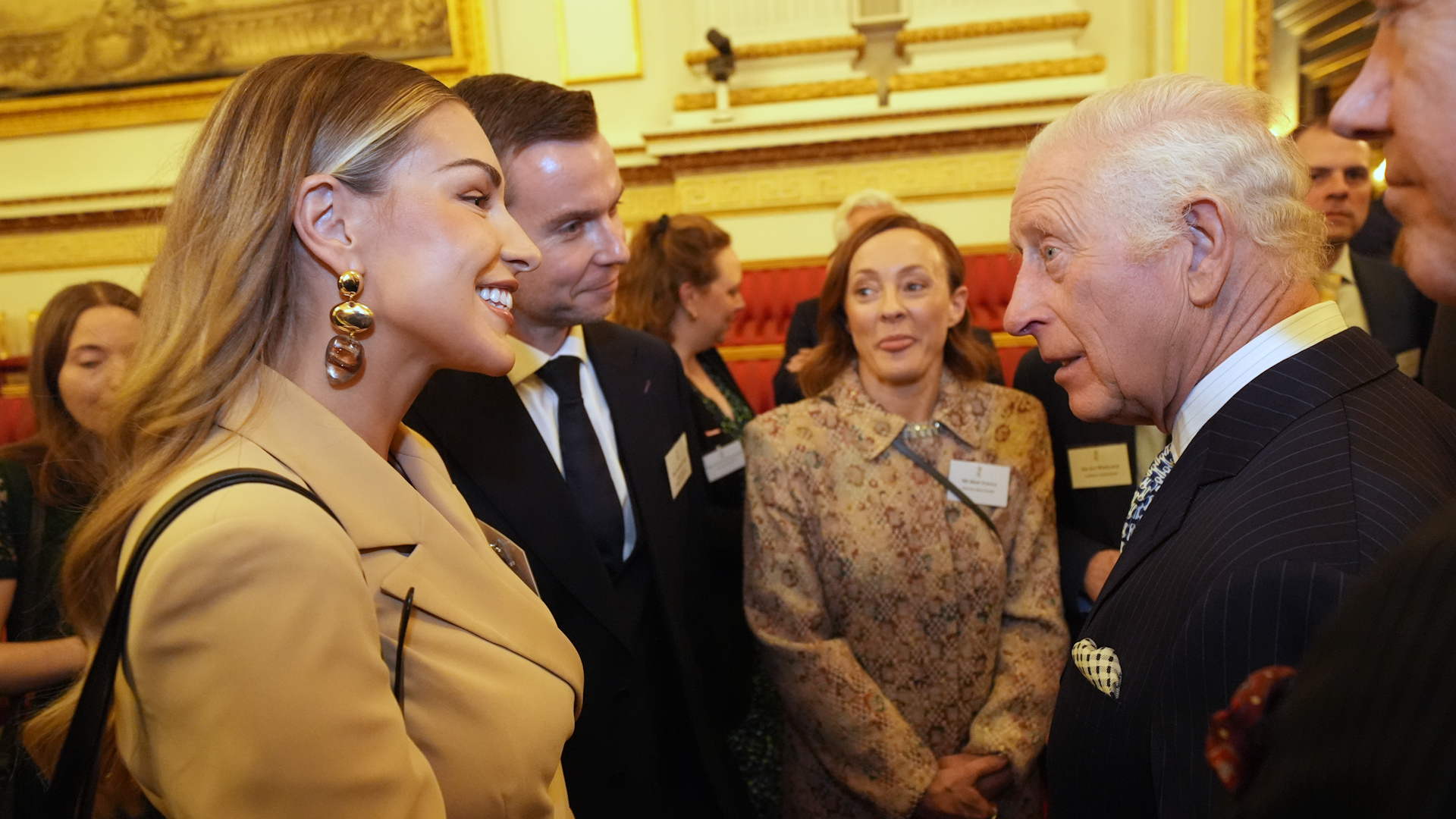 BFBS' Jonathan Trigg pictured next to TV's Zara McDermott and the King 