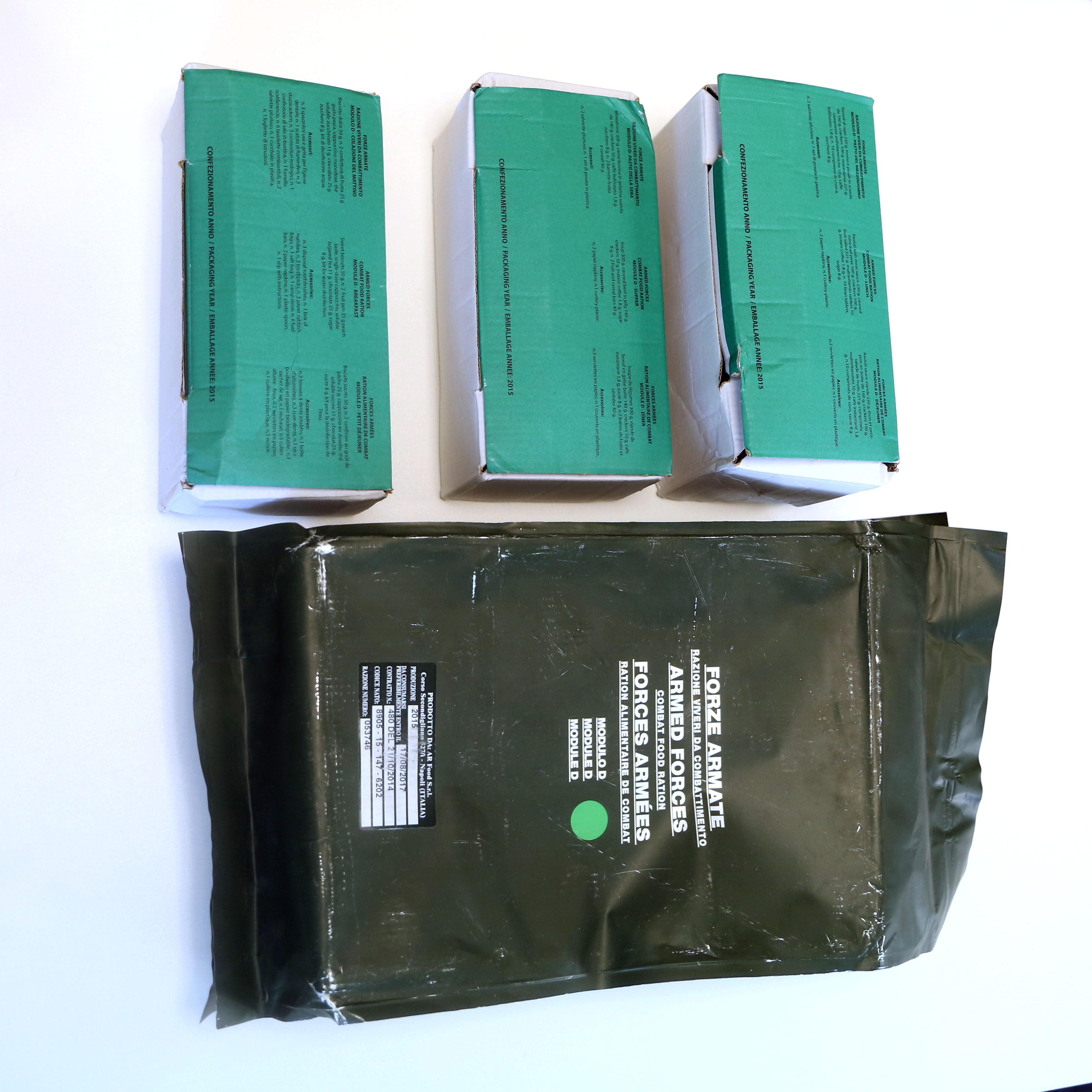 Three ration packs and a larger box