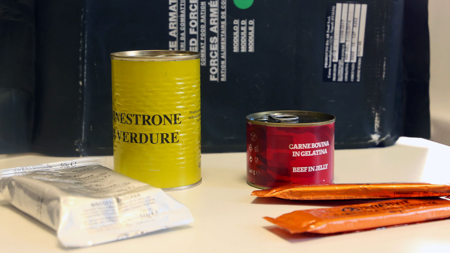 Food cans and chocolate from an Army ration pack in Italy
