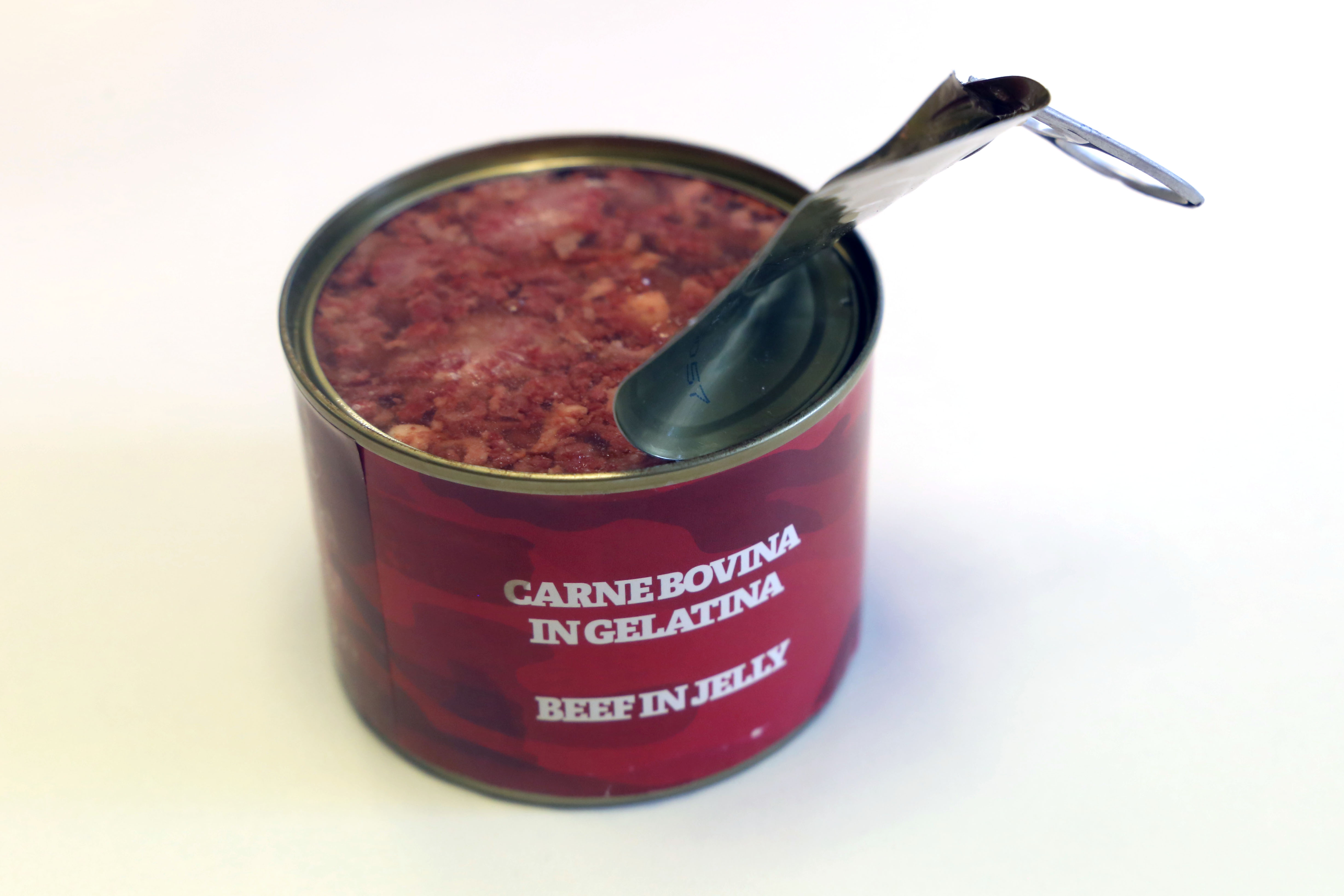 An open can of beef in jelly from a ration pack
