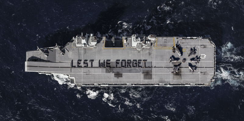 Image spelling out ‘Lest We Forget’ on the 4 acre flight deck of HMS Queen Elizabeth, includes a poppy formed around UK F-35B Lightning jets which are conducting operational trials onboard, ahead of the ship’s first operational deployment in 2021.