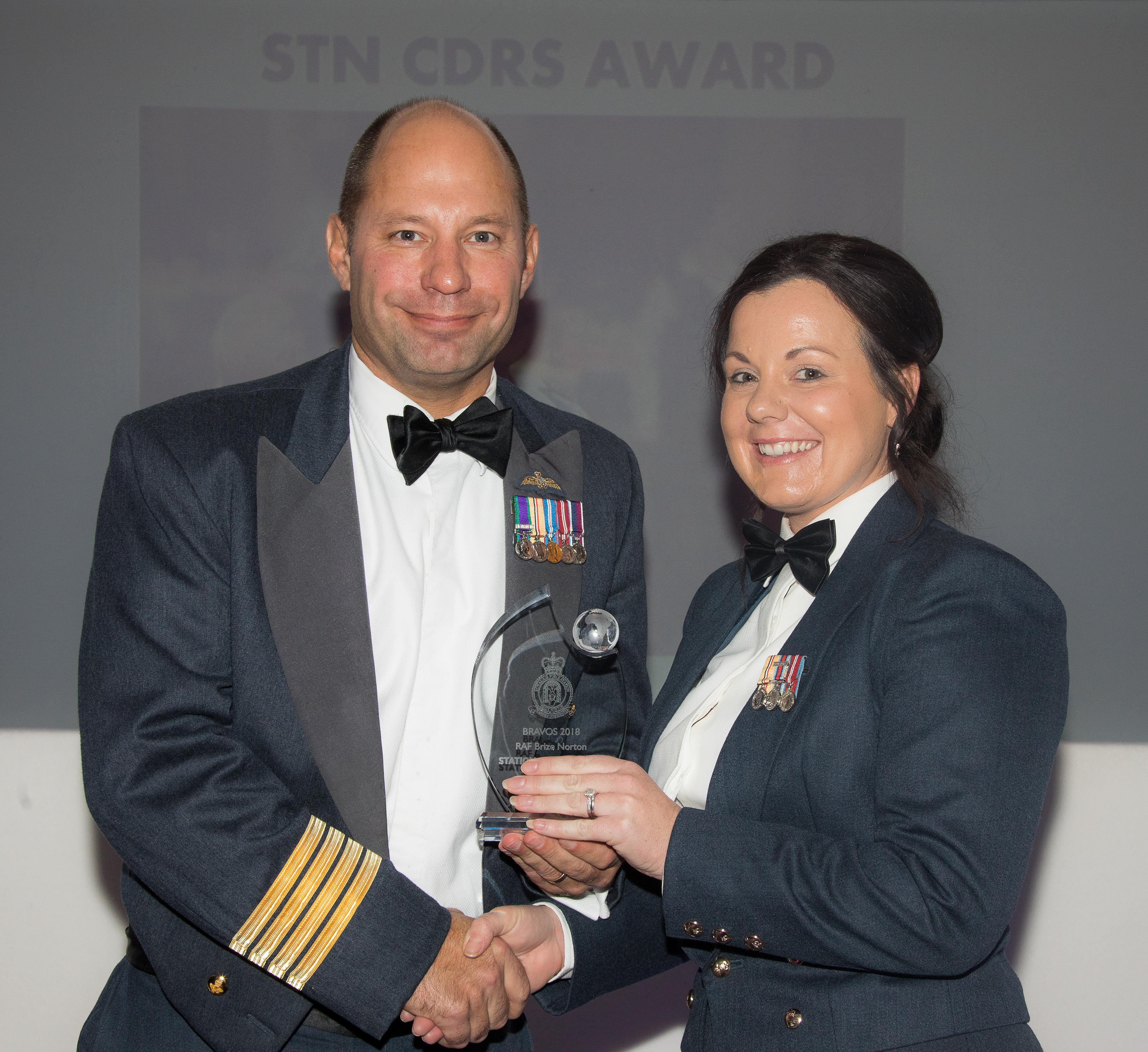 Gp Capt Dan James awards Sgt Nikita Lydon with the Station Commanders Award