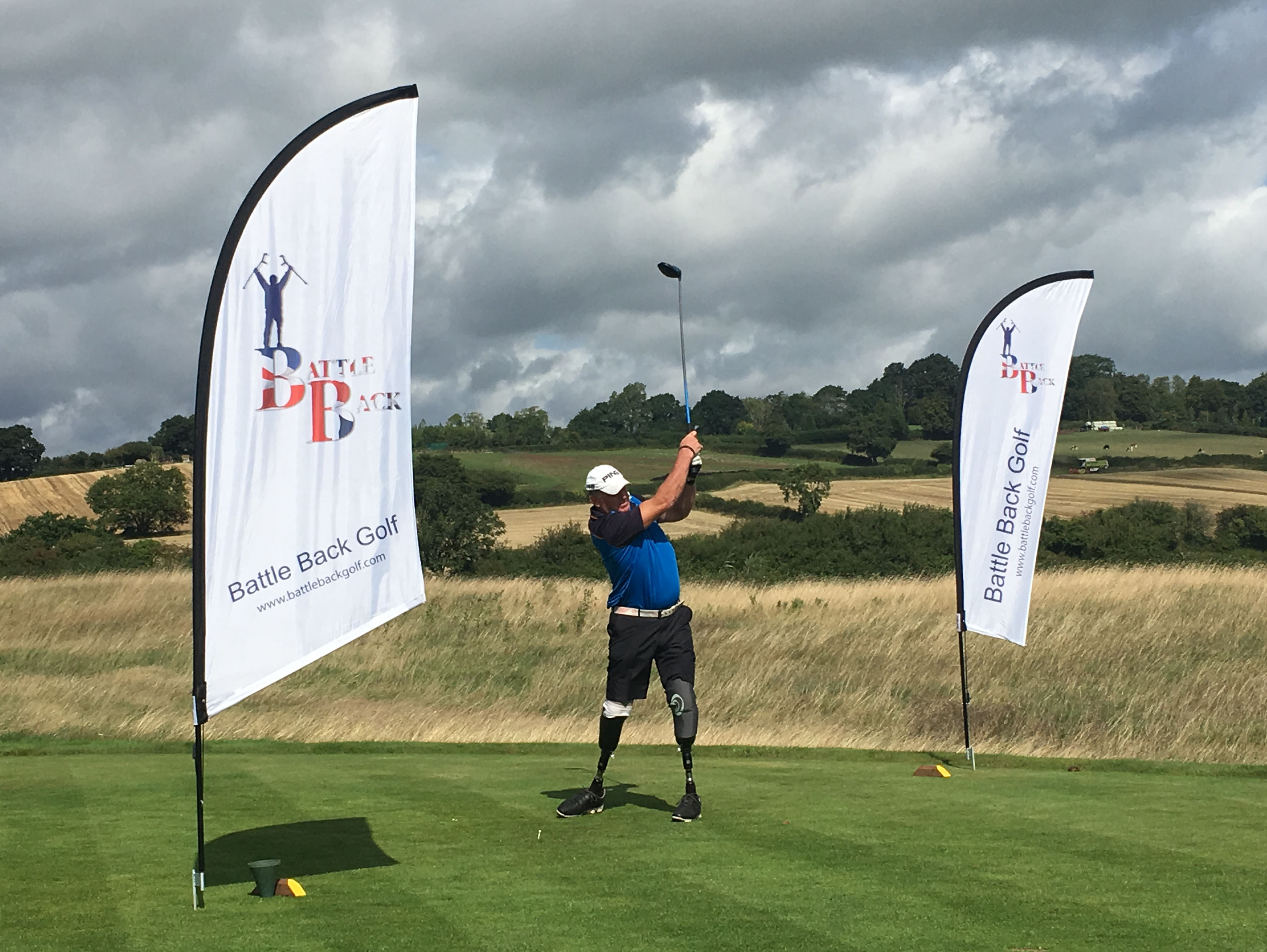 A Battle Back golfer tees off