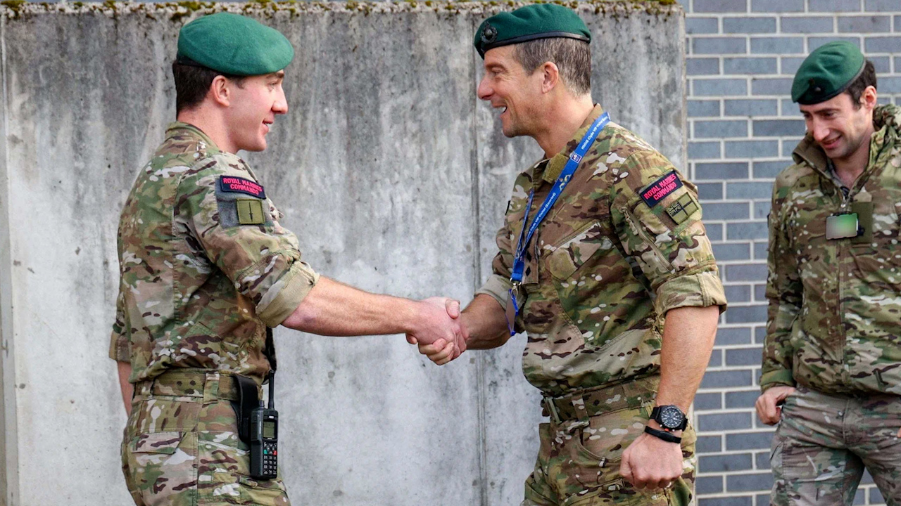 Bear Grylls visited HM Naval Base Clyde and presented his award of Unsung Hero to a Royal Marine (Picture: Royal Navy)