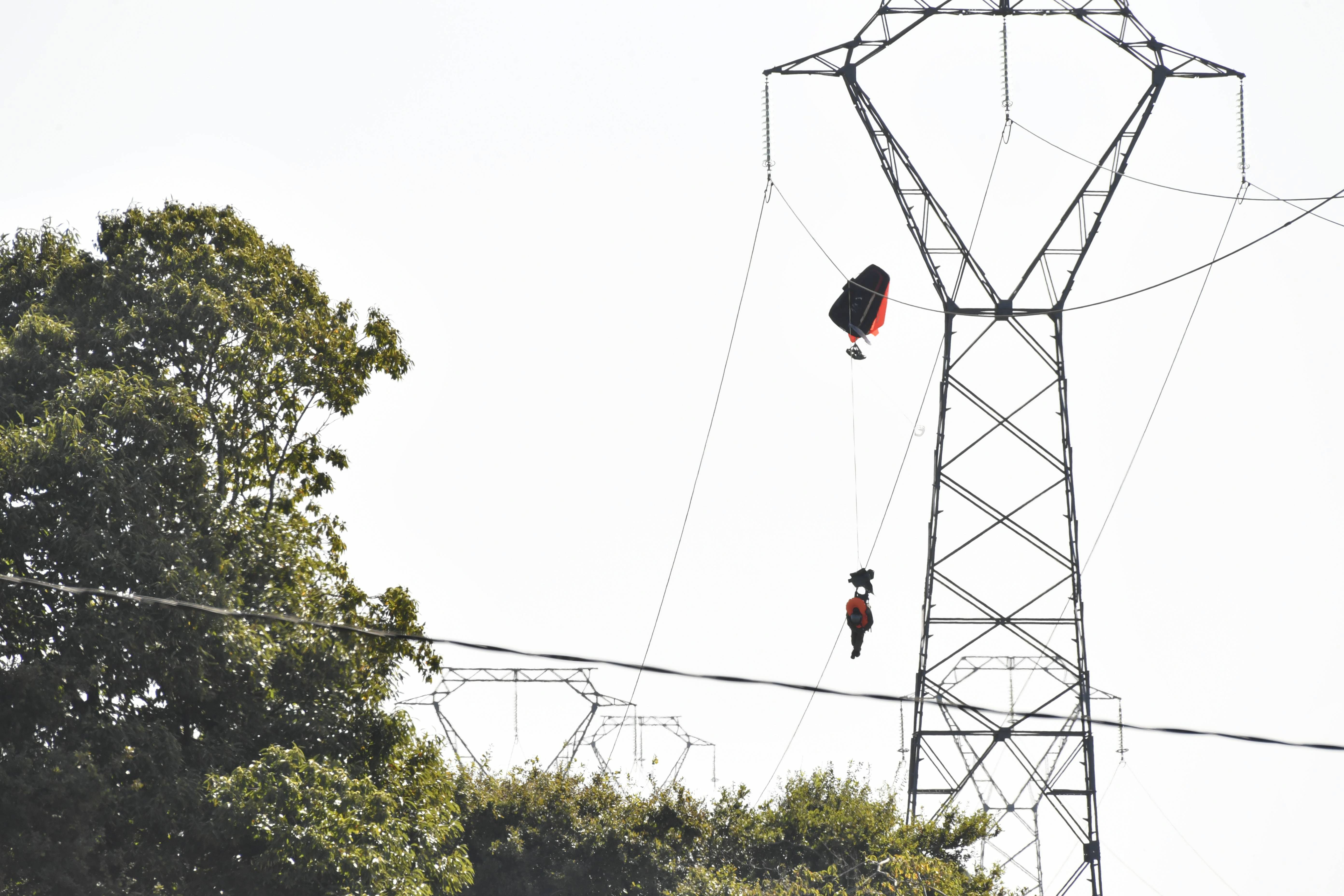 Belgian air force pilot caught on power line after ejecting from aircraft