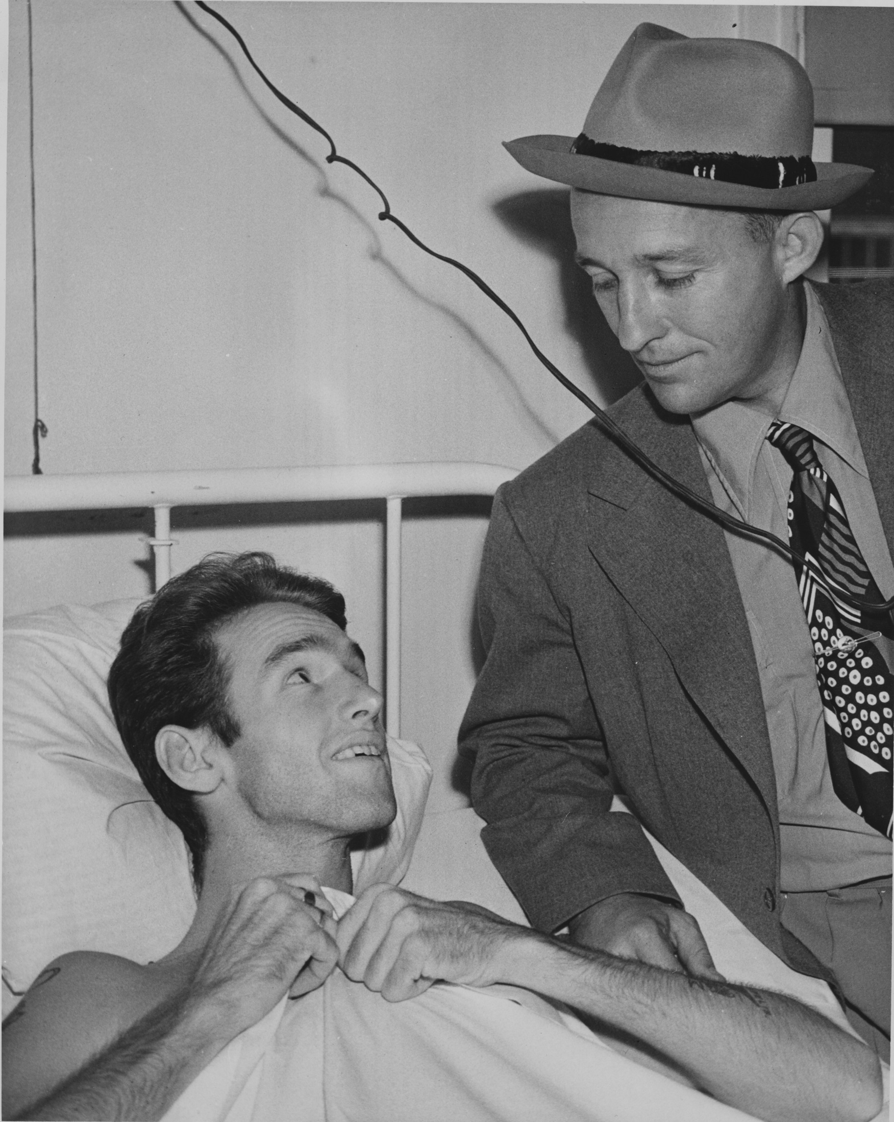 Bing Crosby meets with a US soldier in a Naval Hospital in WWII (Picture: Decca Records).