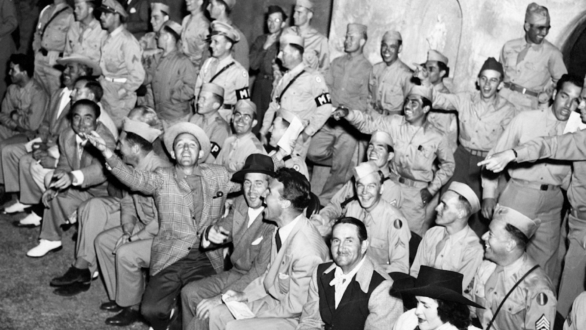 Bing Crosby with soldiers in WWII (Picture: Decca Records).