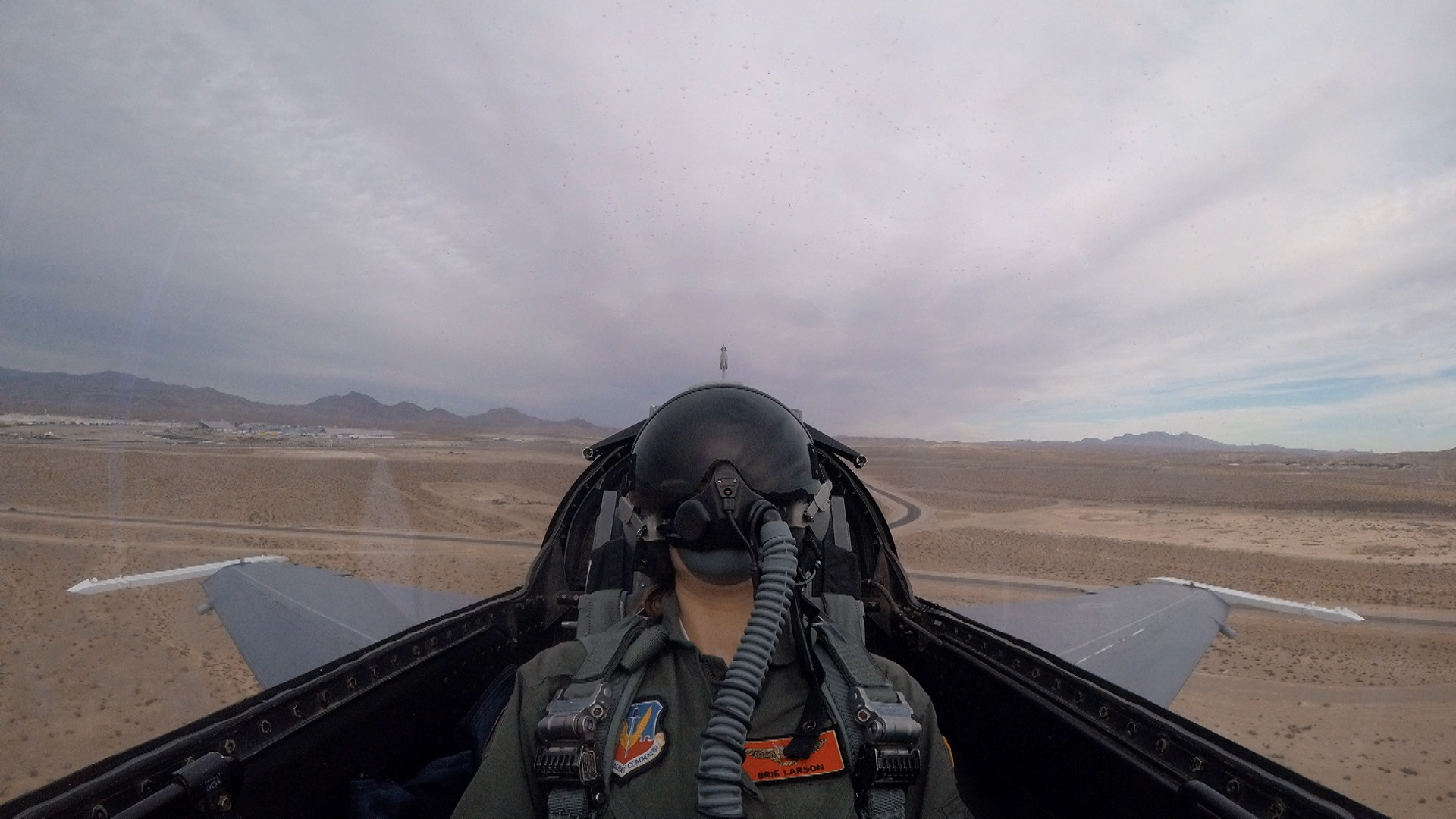 Brie testing out the aerodynamics of an F16 (Picture: Disney).