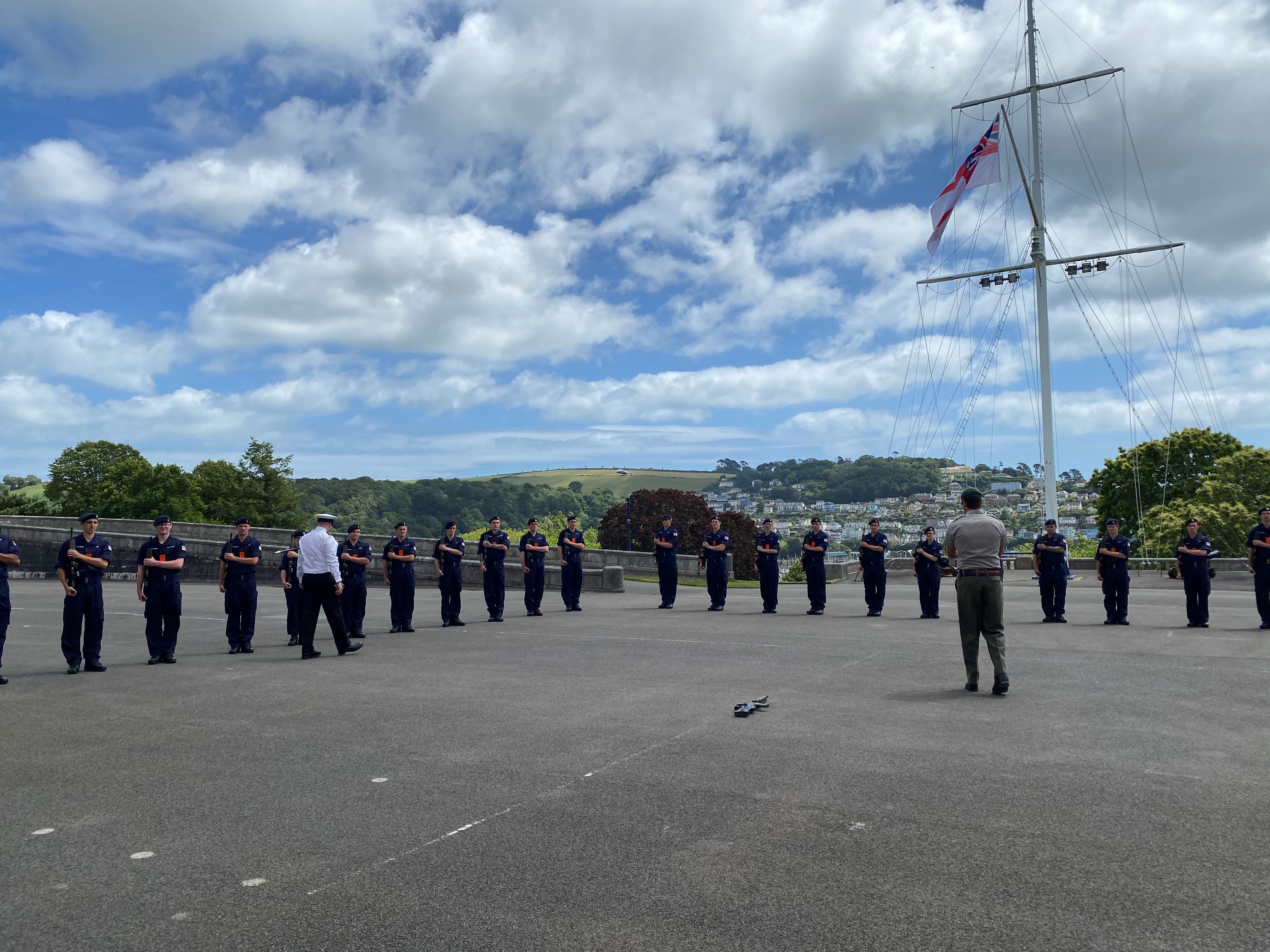 Britannia Royal Naval College recruits and an instructor.