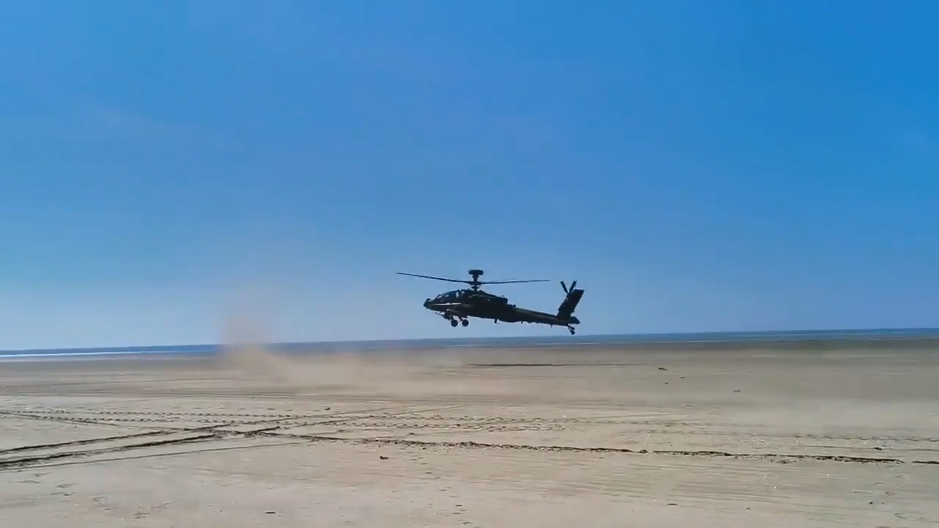 British Army Apache lands on Army's training area at Pembrey Sands