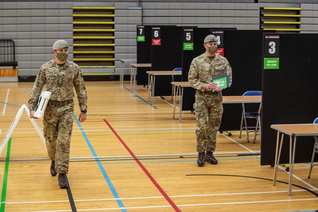 Cover image: Soldiers set up a vaccine centre in Scotland (Picture: MOD).