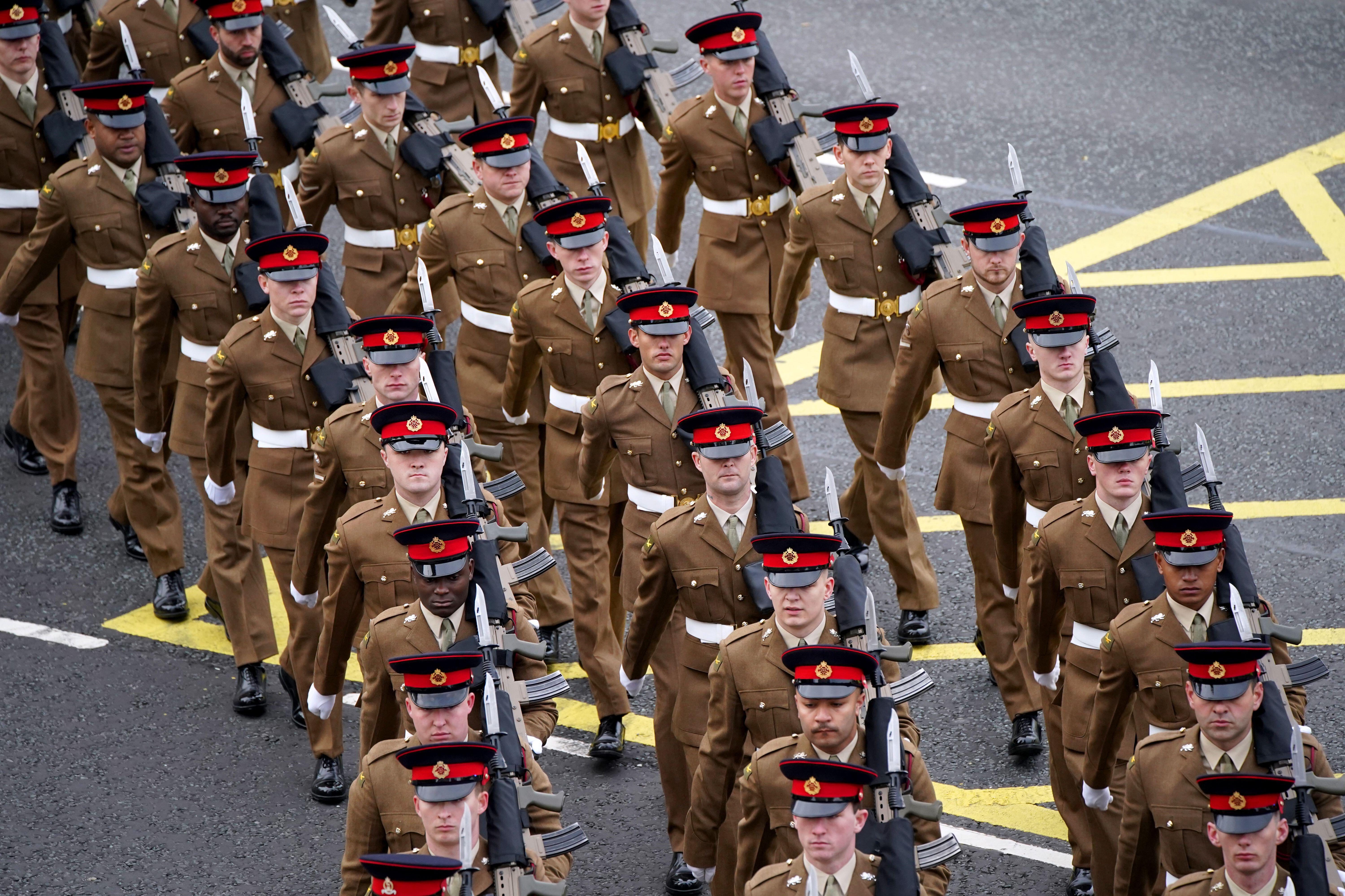 Soldiers from 1st Battalion of The Duke Of Lancaster's Regiment march through the streets of Liverpool on Armistice Day 