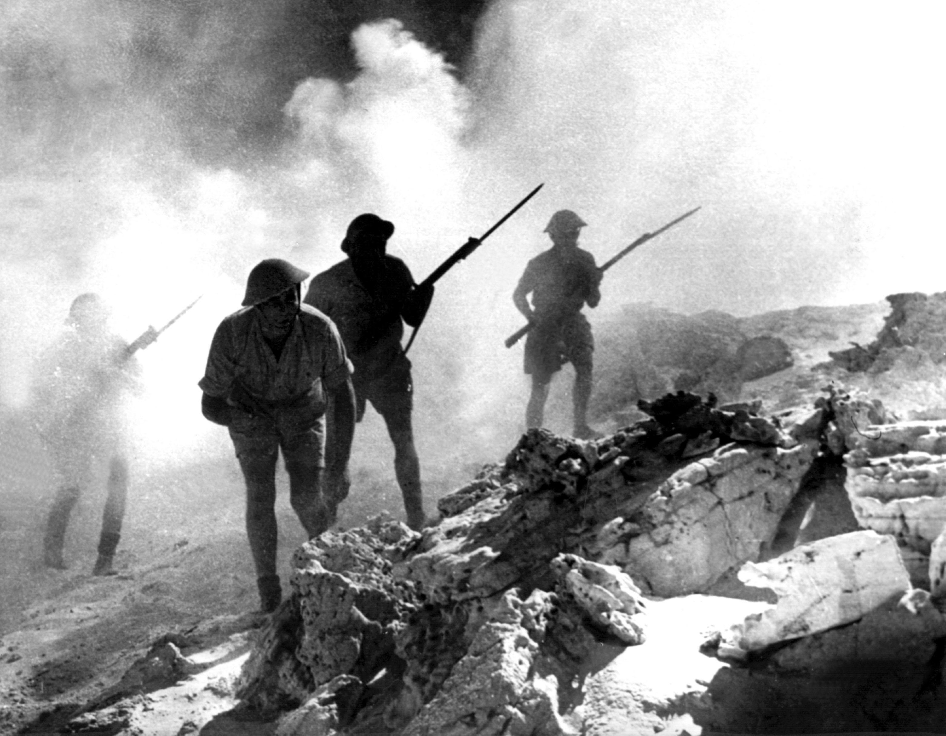 British soldiers or Desert Rats advancing with fixed bayonets during the battle of El Alamein in 1942 (Picture: PA).