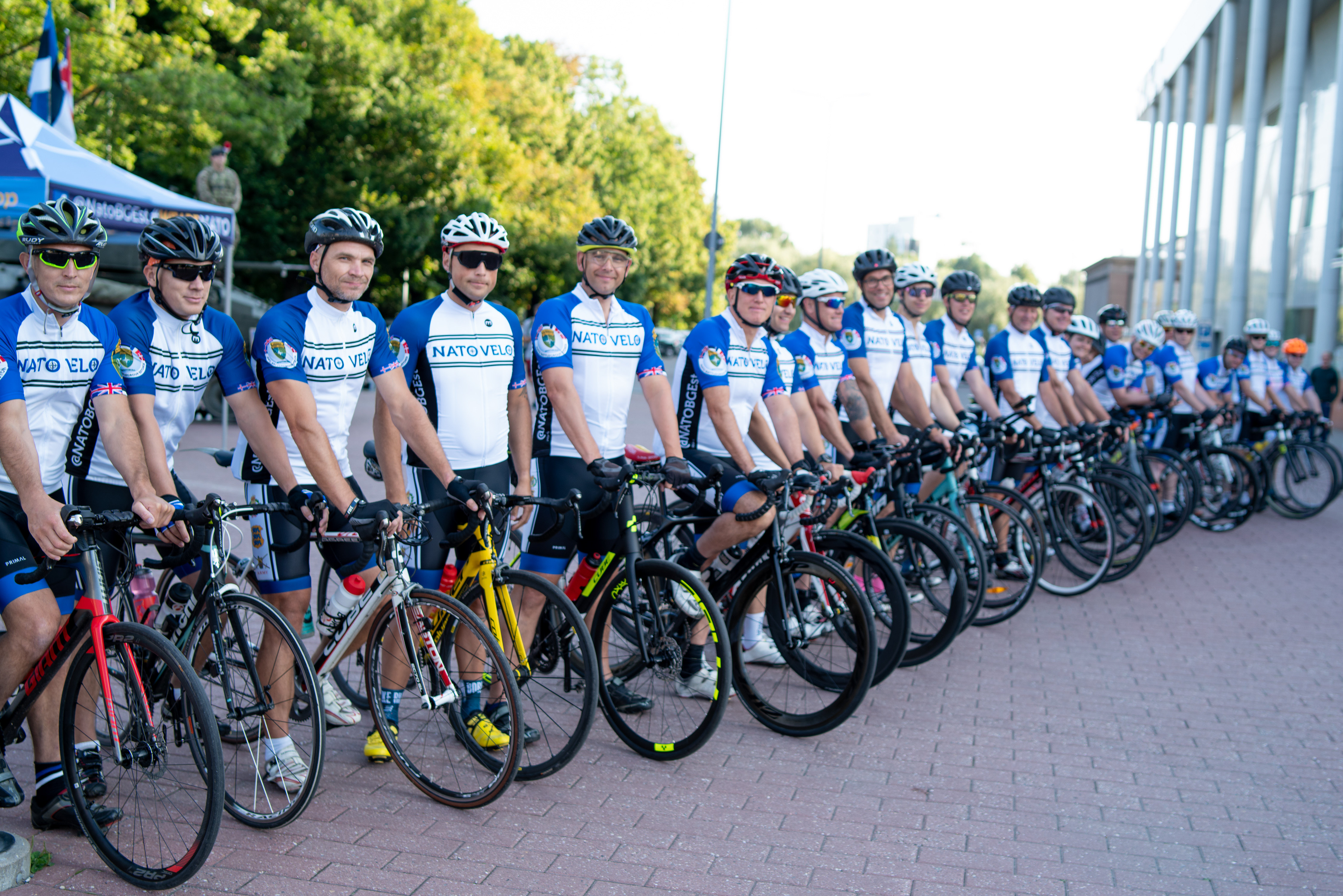 British, Danish and Estonian NATO personnel line up to take part in NATO Velo, a 1000km cycle across Estonia organised by NATO's enhanced Forward Presence 150820 CREDIT NATO