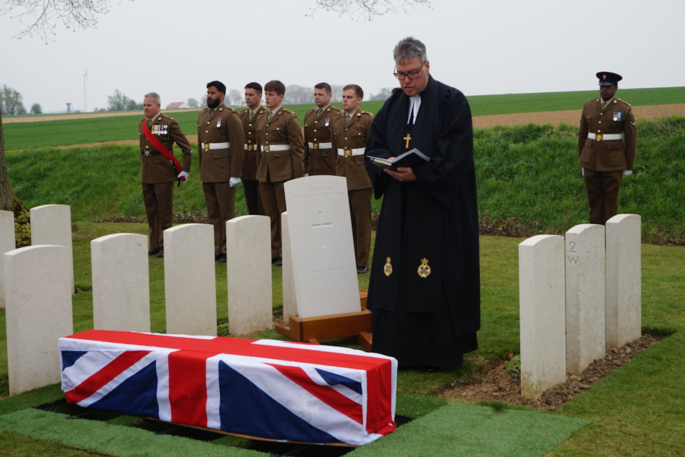 The Reverend Tim Flowers conducts the burial service at the graveside of the unknown soldier in Guards Cemetery, Lesboeufs (Picture: MOD).
