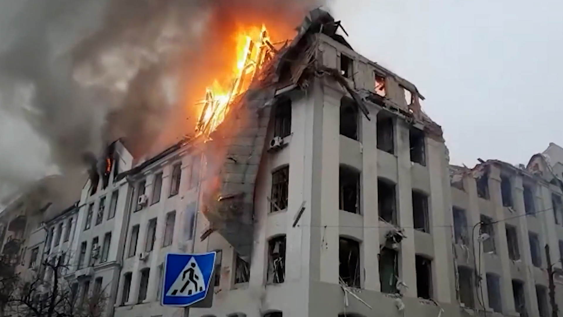 Burning building collapsing in the aftermath of shelling in Kharkiv, northeast Ukraine 