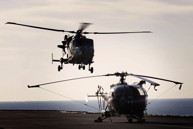 Royal Navy Wildcat and French Navy Alouette helicopters