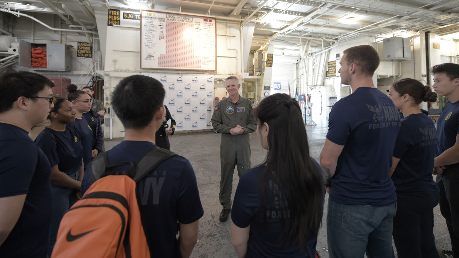 Chief of Navy Air Training Rear Adm Daniel Dwyer speaks to future Sailors from Navy Recruiting District San Francisco on the USS Hornet Sea, Air and Space Museum in February 2020 CREDIT US Navy