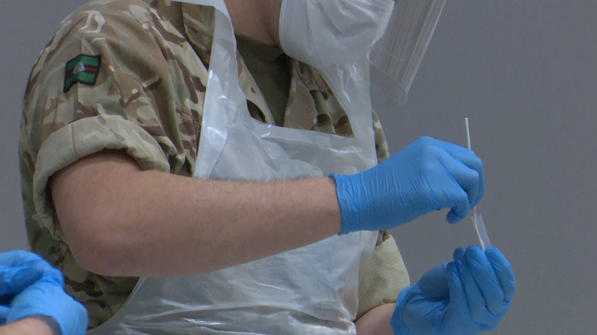 CORONAVIRUS Anonymous picture of a soldier checking a kit as civilians in Liverpool are given training in how to carry out COVID testing 261120 CREDIT BFBS
