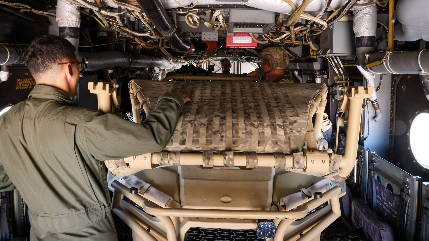 Corporal Fletcher of 40 Commando safely loads a UK Polaris MZRZ- D4 for the first ever time on a US Osprey MV- 22 CREDIT Crown Copyright