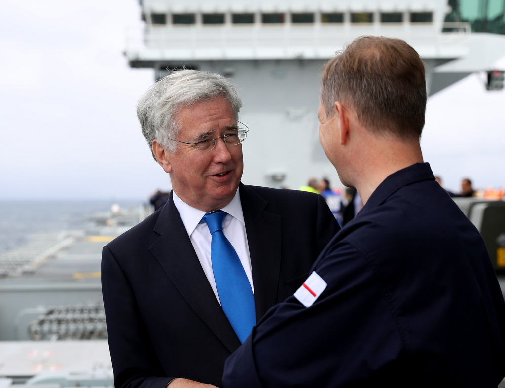 Sir Michael Fallon (left) with the Captain of HMS Queen Elizabeth, Jerry Kid (right).