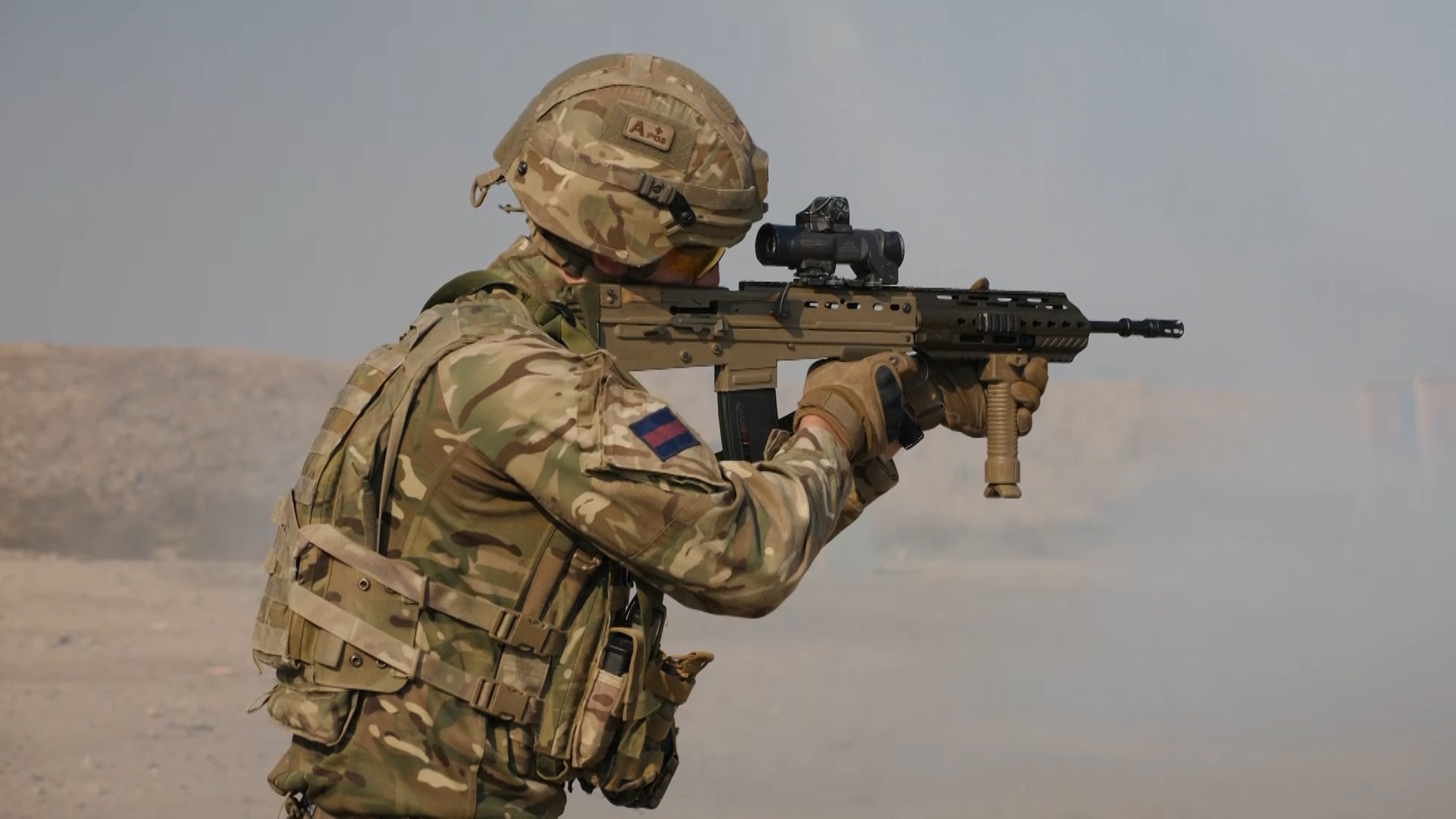 A Grenadier zero's his rifle