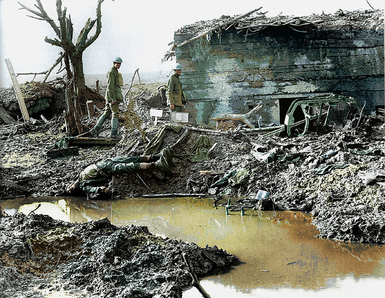 Canadian soldiers survey a destroyed German bunker Nov 1917