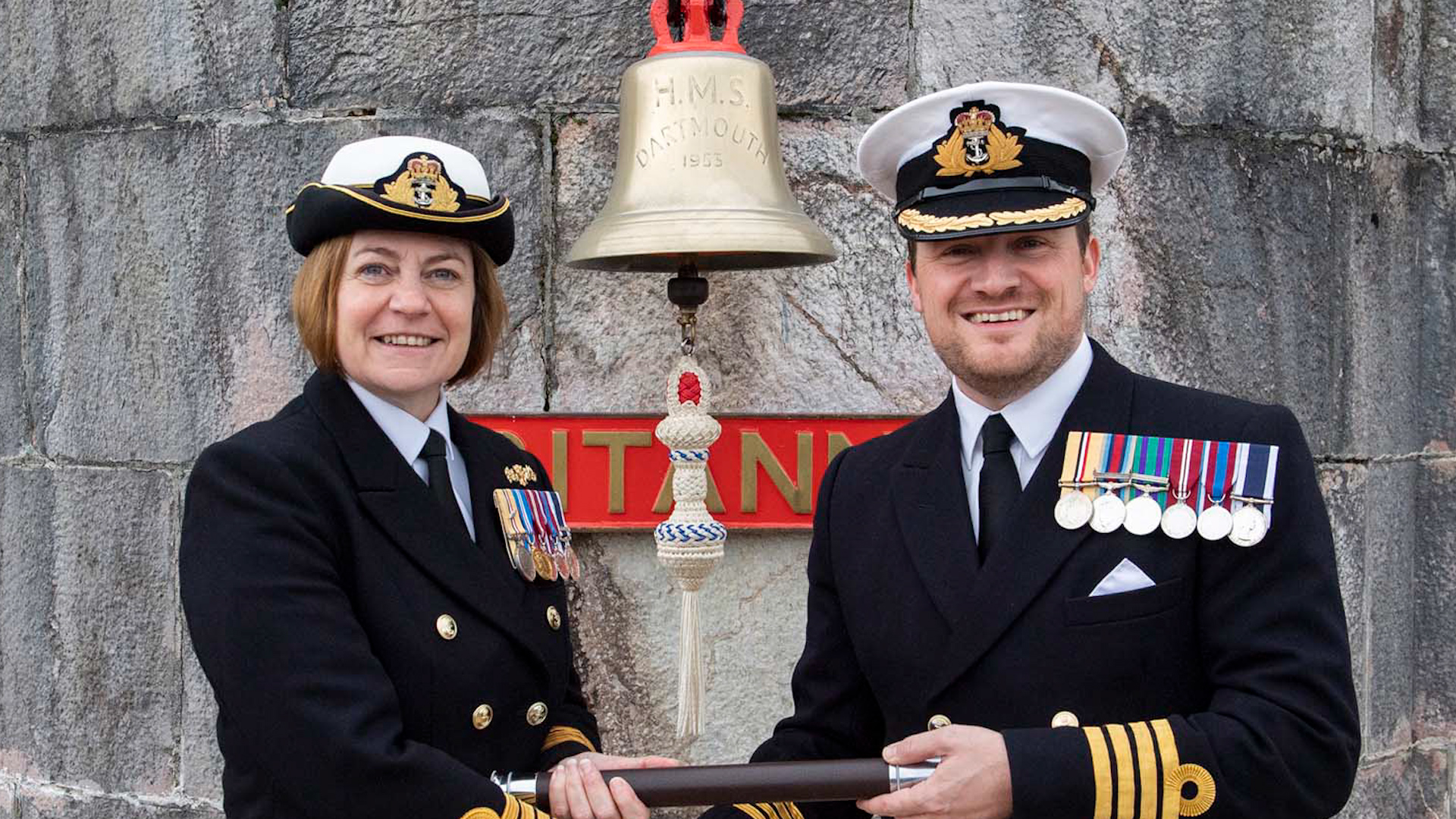 Captain Andrew Bray takes the reins from Captain Sarah Oakley at the helm of Britannia Royal Naval College (Picture: Royal Navy).