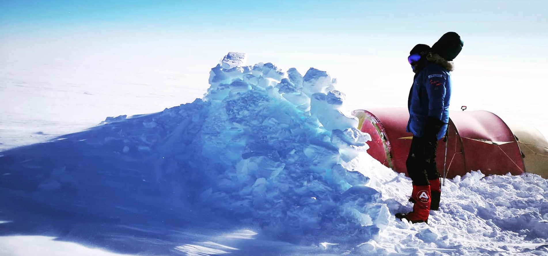 Captain Harpreet Chandi building a snow wall in preparation for a storm in Greenland