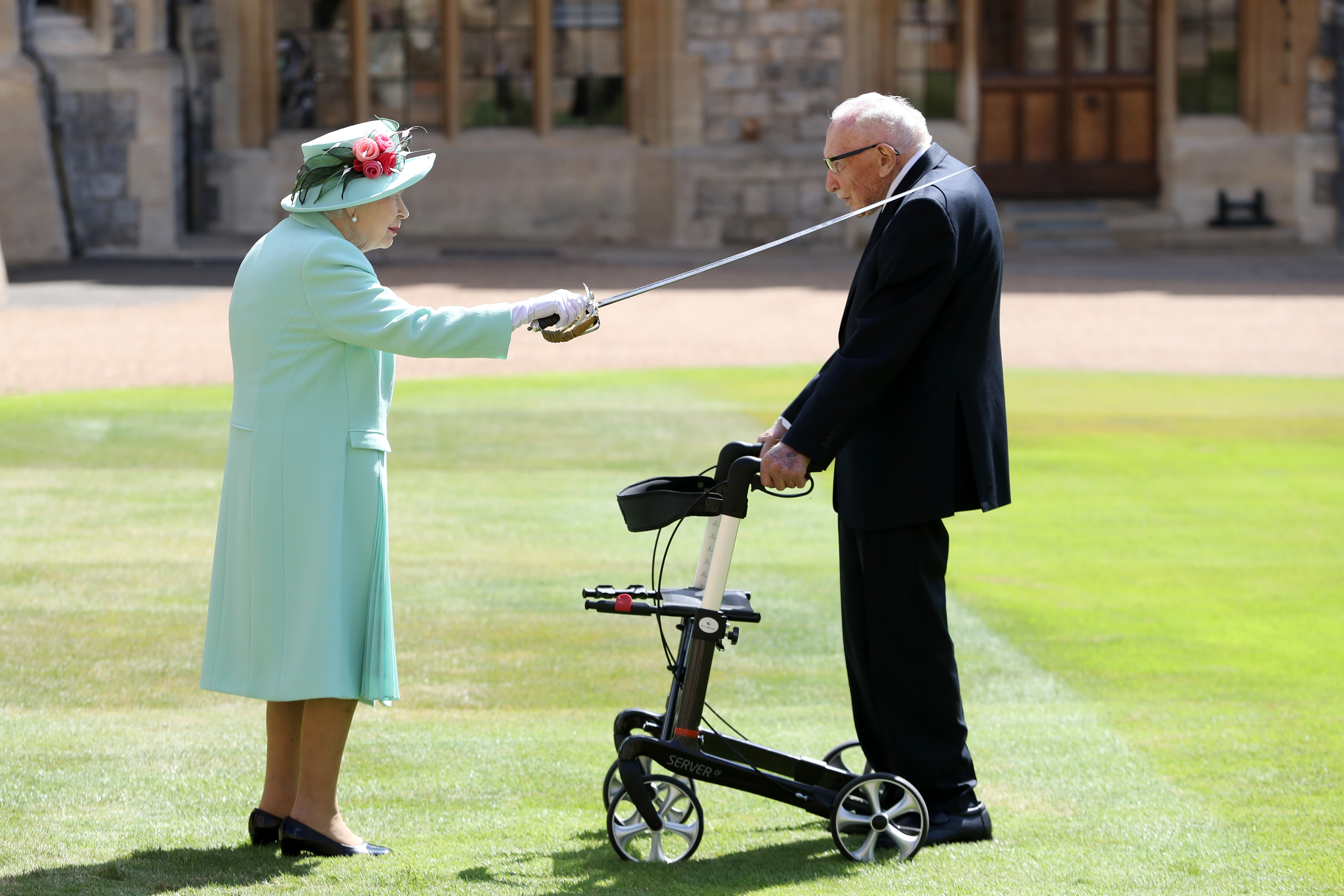Capt Sir Tom was knighted by the Queen at Windsor Castle in July last year (Picture: PA).