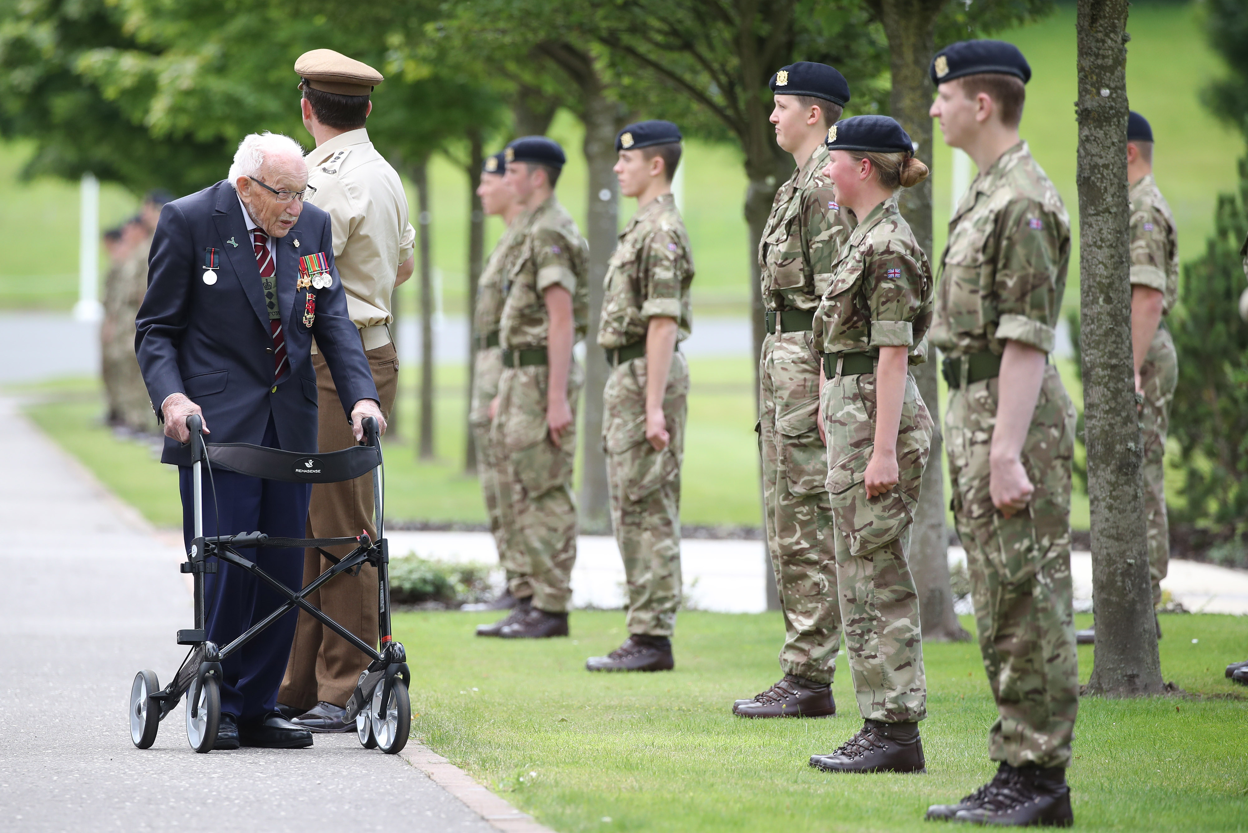 Captain Sir Tom Moore was given a guard of honour when he visited the college last year (Picture: PA).
