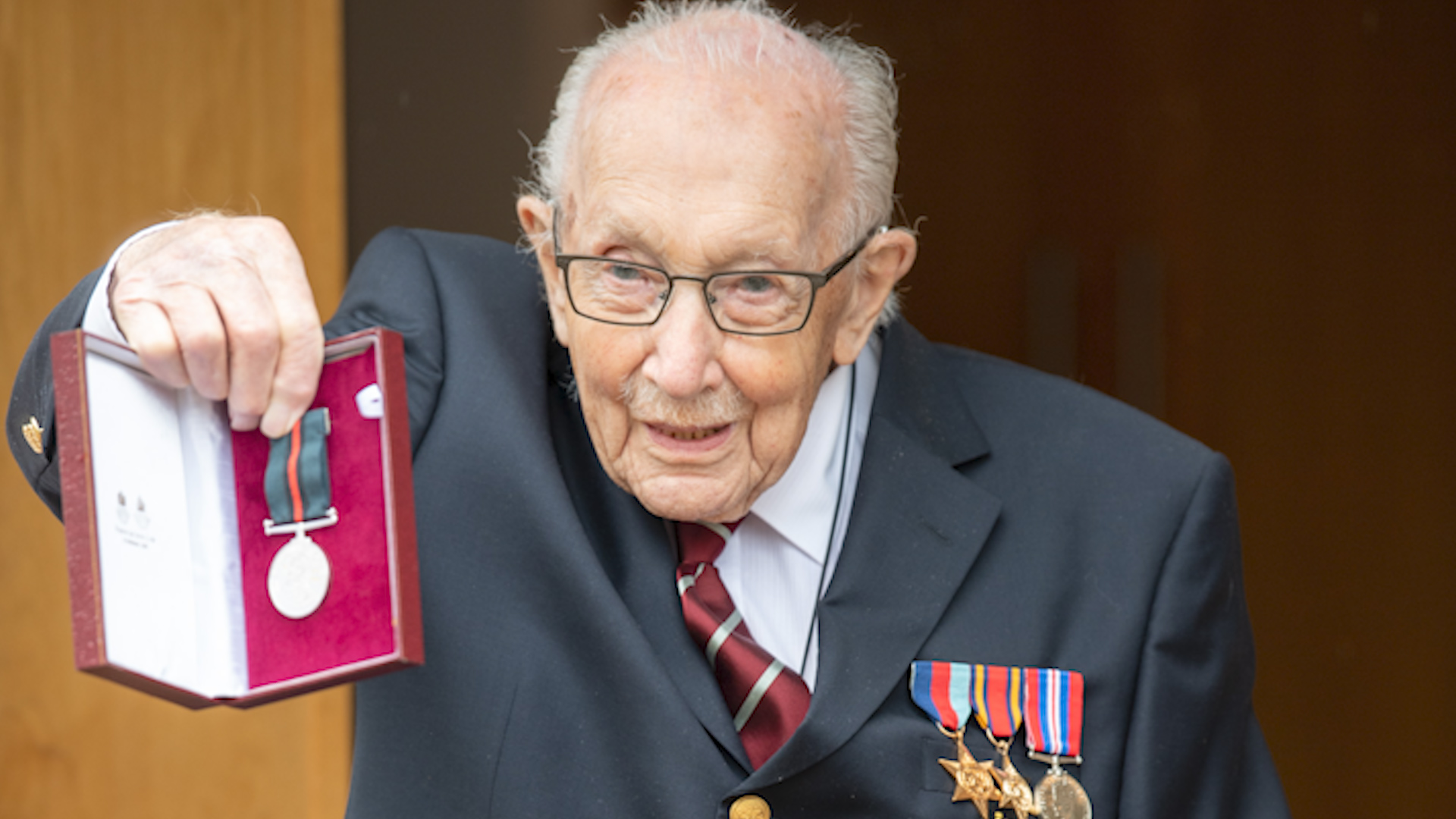 Capt Tom was also presented with his Second World War Defence Medal after he lost the original (Picture: MOD).
