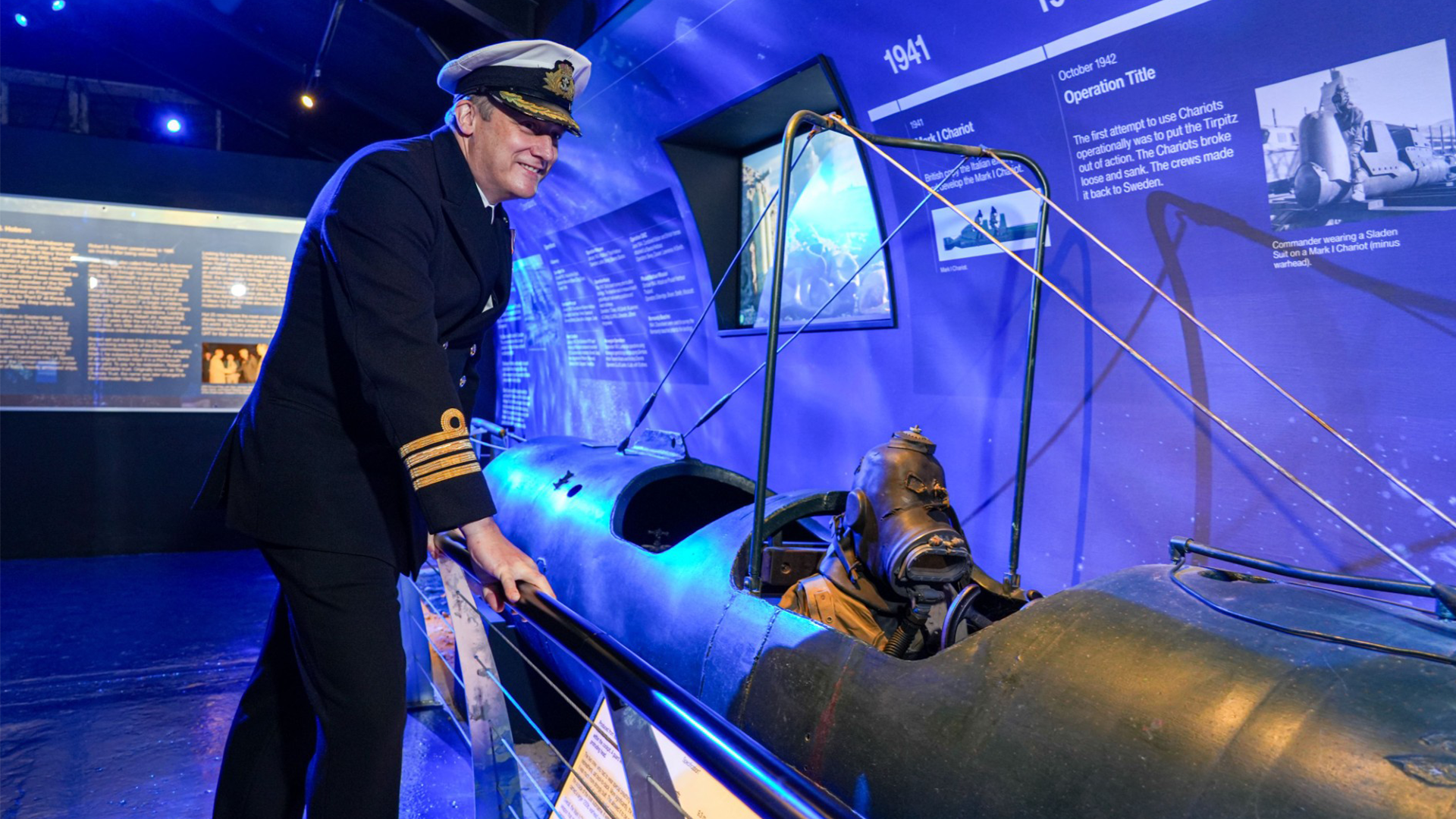 Captain, Captain Justin Codd admiring a Human Torpedo CREDIT ROYAL NAVY
