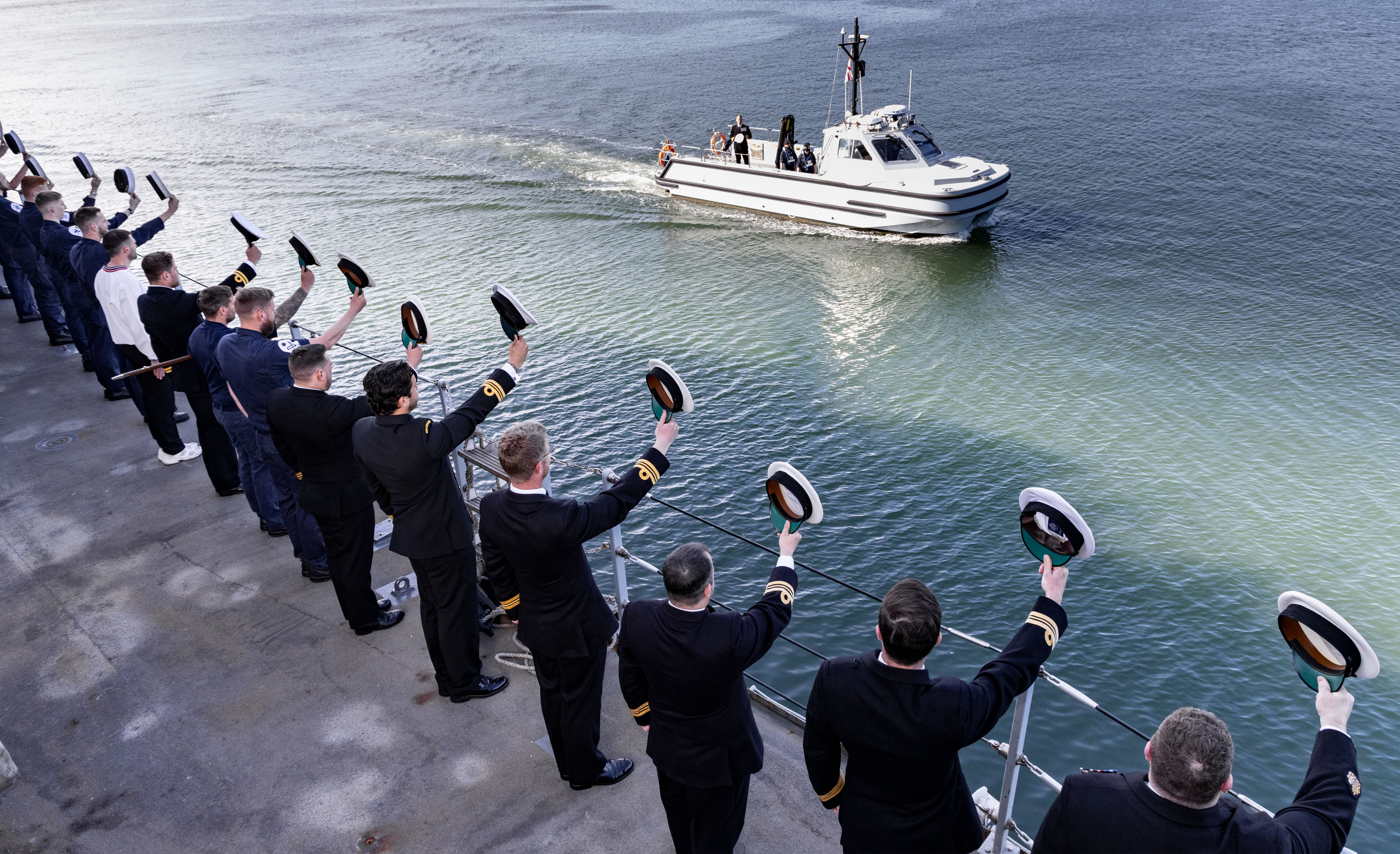 Cdr Ainsley departs, being seen over the side in traditional style (Picture: Crown Copyright)