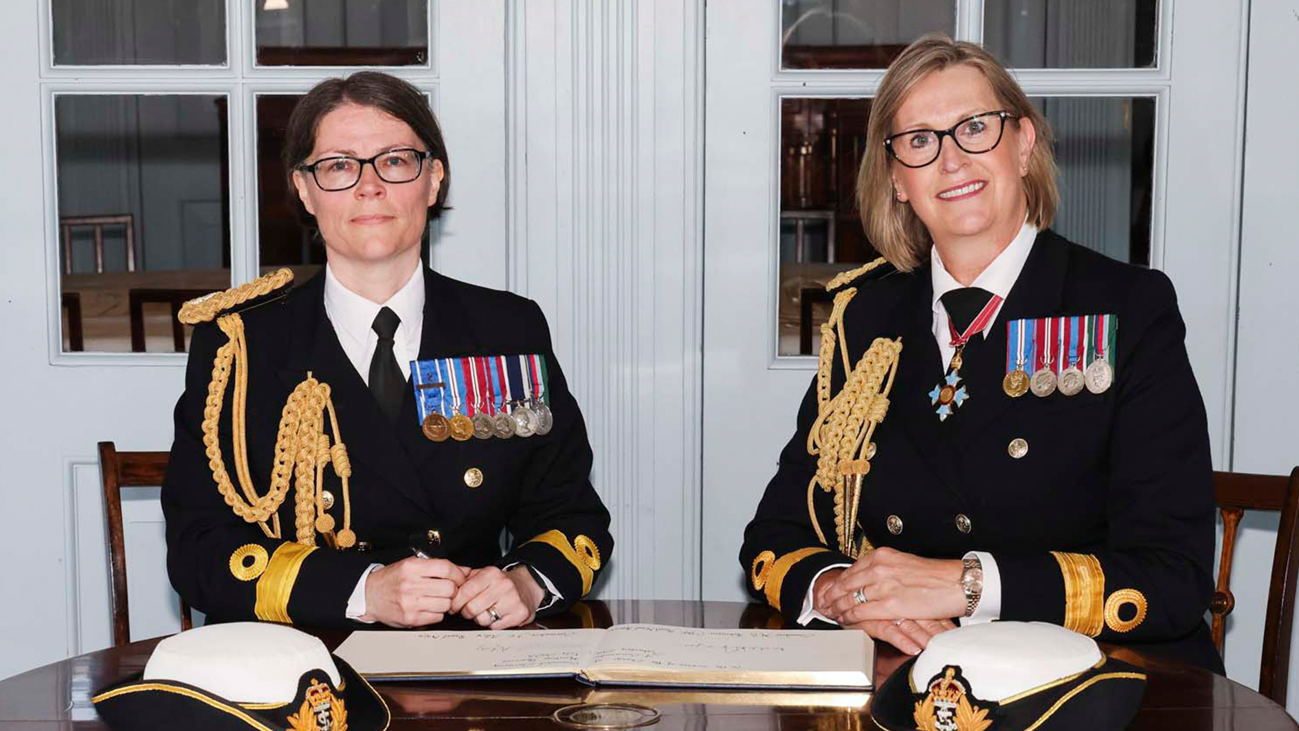 Cdr Jo Adey RN takes command f the Maritime Reserves from Cdr Mel Robinson CBE RNR CREDIT ROYAL NAVY