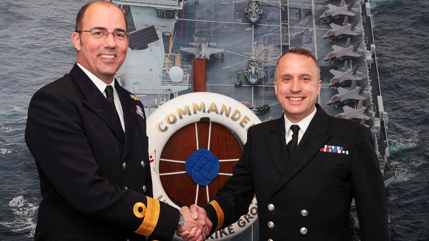 Cdre Essenhigh left hands over to Cdre Blackmore UK Carrier Strike Group 24052023 CREDIT Royal Navy