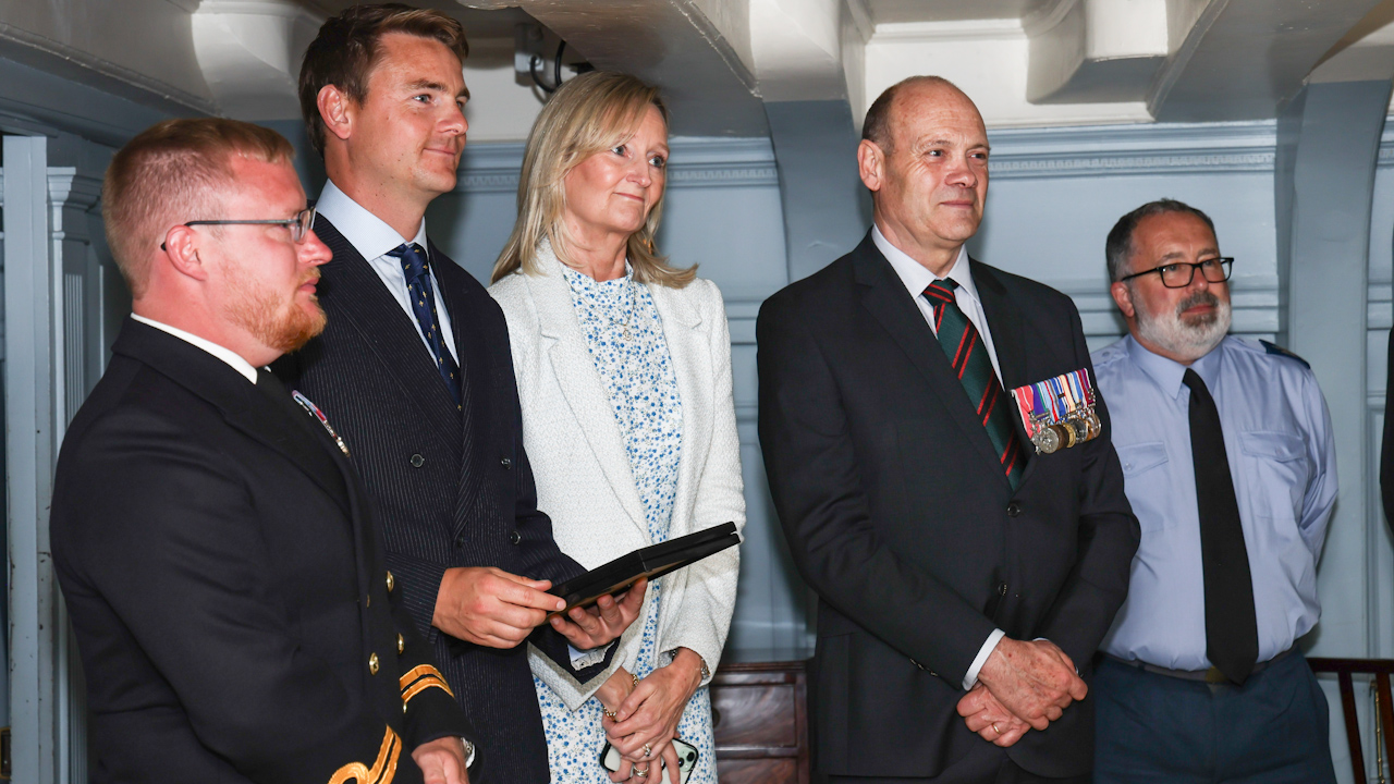 On 13 June 2024, Cdre Steve Large (DE&S Ship) and Lt Col Andrew Chapman (Chief Exec Royal Humane Society) presented the Royal Humane Society Award to James Gray, who saved the life of Lt James Jeffcote of HMS Spey last year (Picture: Royal Navy)