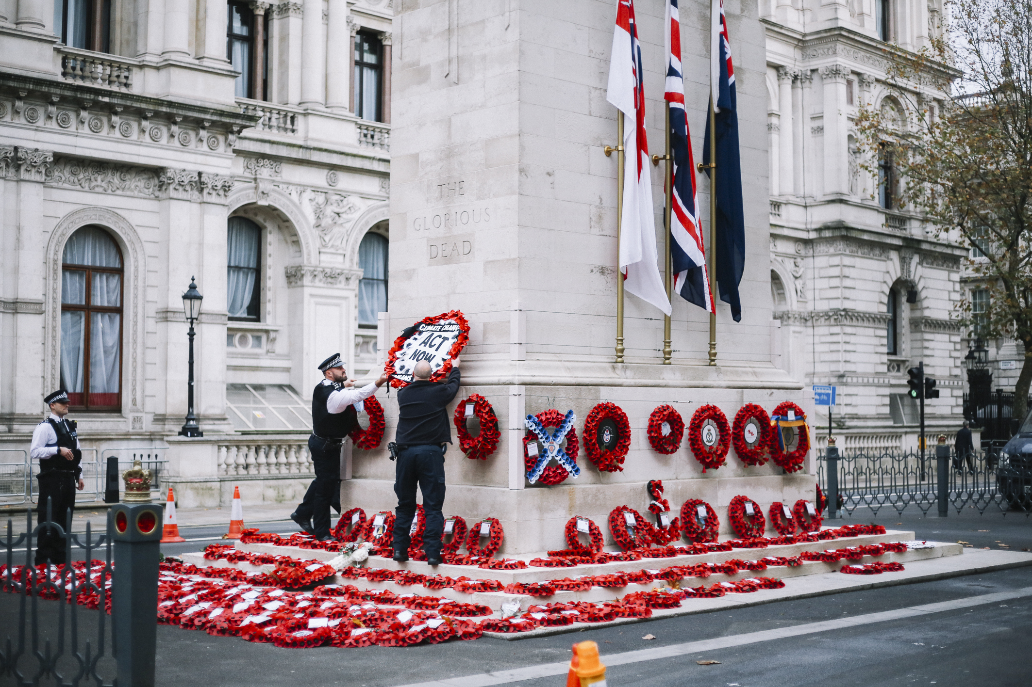 Pictures from Extinction Rebellion show the wreath being removed (Picture: TheLightscaper/Extinction Rebellion).