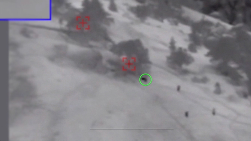 Chapman can be seen charging uphill toward enemy positions while under heavy fire from three directions (credit: US Dept of defense)