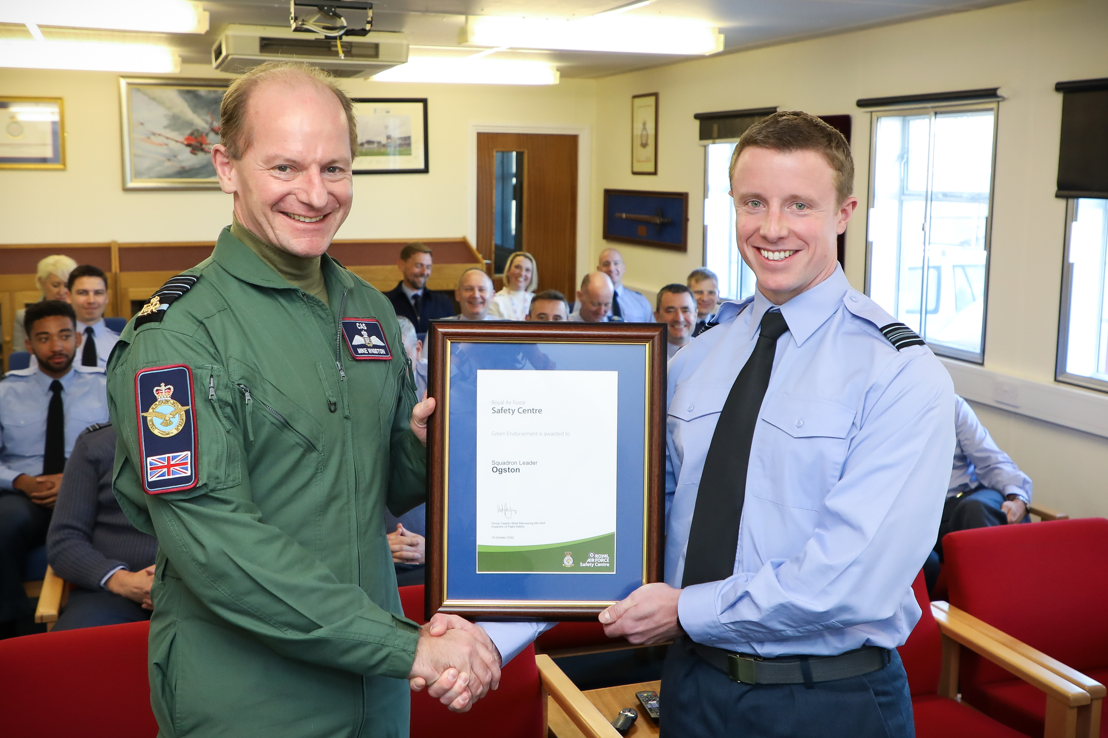 Chief of the Air Staff, Air Chief Marshal Sir Mike Wigston, left, presents the award to Squadron Leader Gregor Ogston (Picture: Royal Air Force).