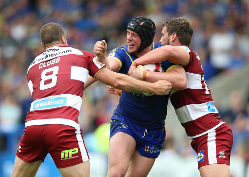 Chris Hill (middle) against Wigan Warriors (Picture: PA).